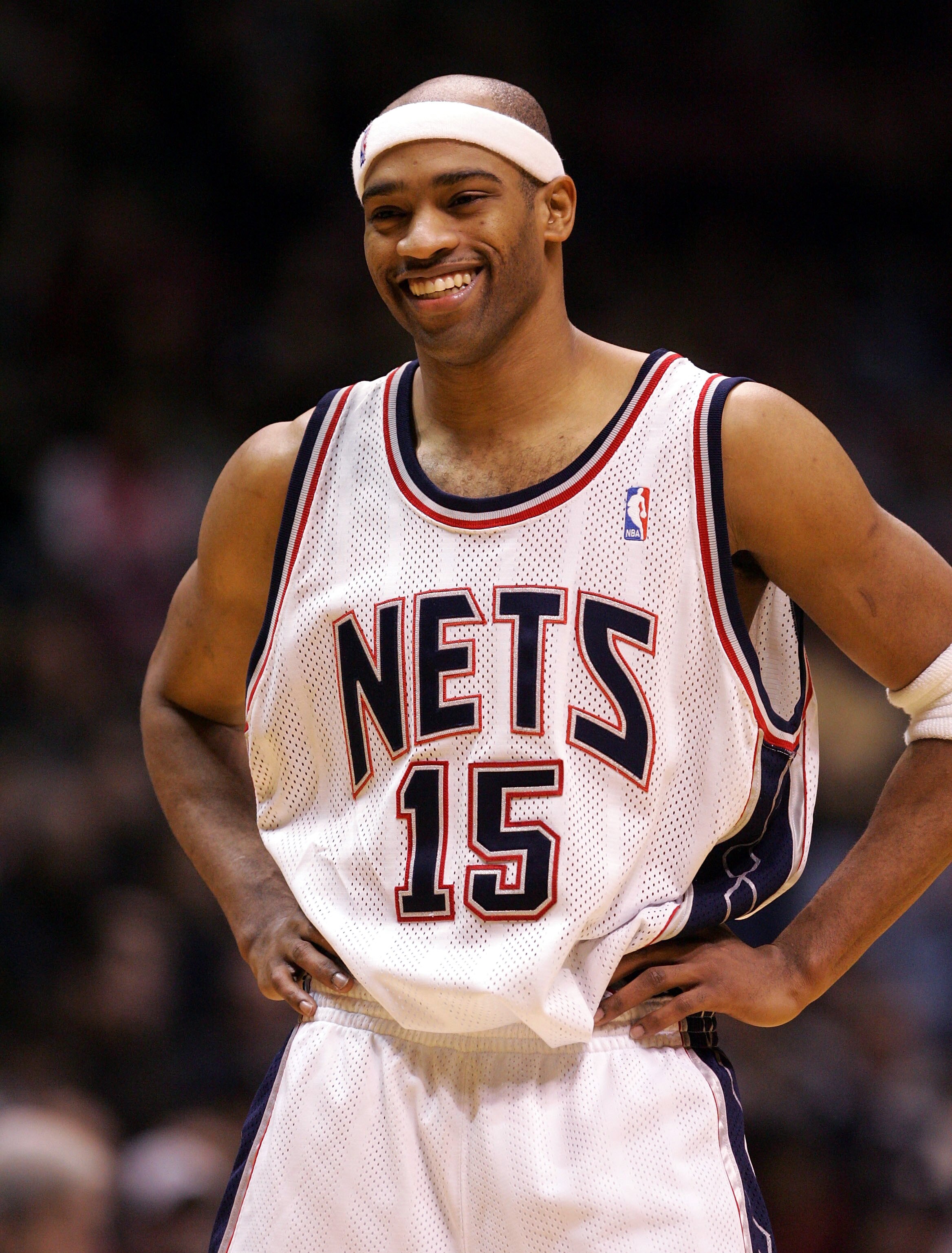 EAST RUTHERFORD, NJ - DECEMBER 30: Vince Carter #15 of the New Jersey Nets smiles during a time out against the Indiana Pacers on December 30, 2004 at Continental Airlines Arena in East Rutherford, New Jersey.  NOTE TO USER:  User expressly acknowledges a