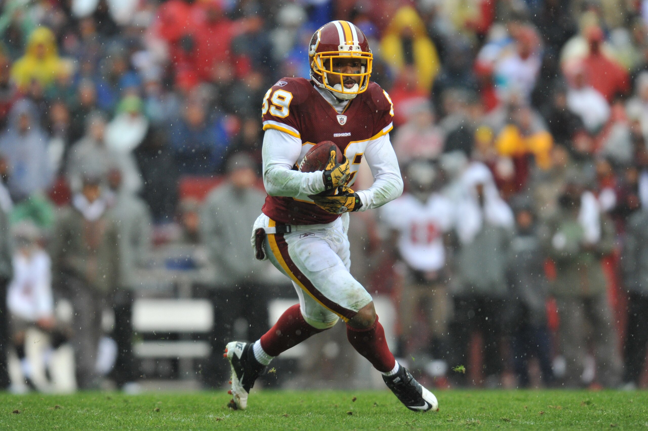 LANDOVER, MD - DECEMBER 12: Santana Moss #89 of the Washington Redskins runs the ball after a catch during the game against the Tampa Bay Buccaneers at FedExField on December 12, 2010 in Landover, Maryland. The Buccaneers defeated the Redskins 17-16. (P LANDOVER, MD - DECEMBER 12: Santana Moss #89 of the Washington Redskins runs the ball after a catch during the game against the Tampa Bay Buccaneers at FedExField on December 12, 2010 in Landover, Maryland. The Buccaneers defeated the Redskins 17-16. (P