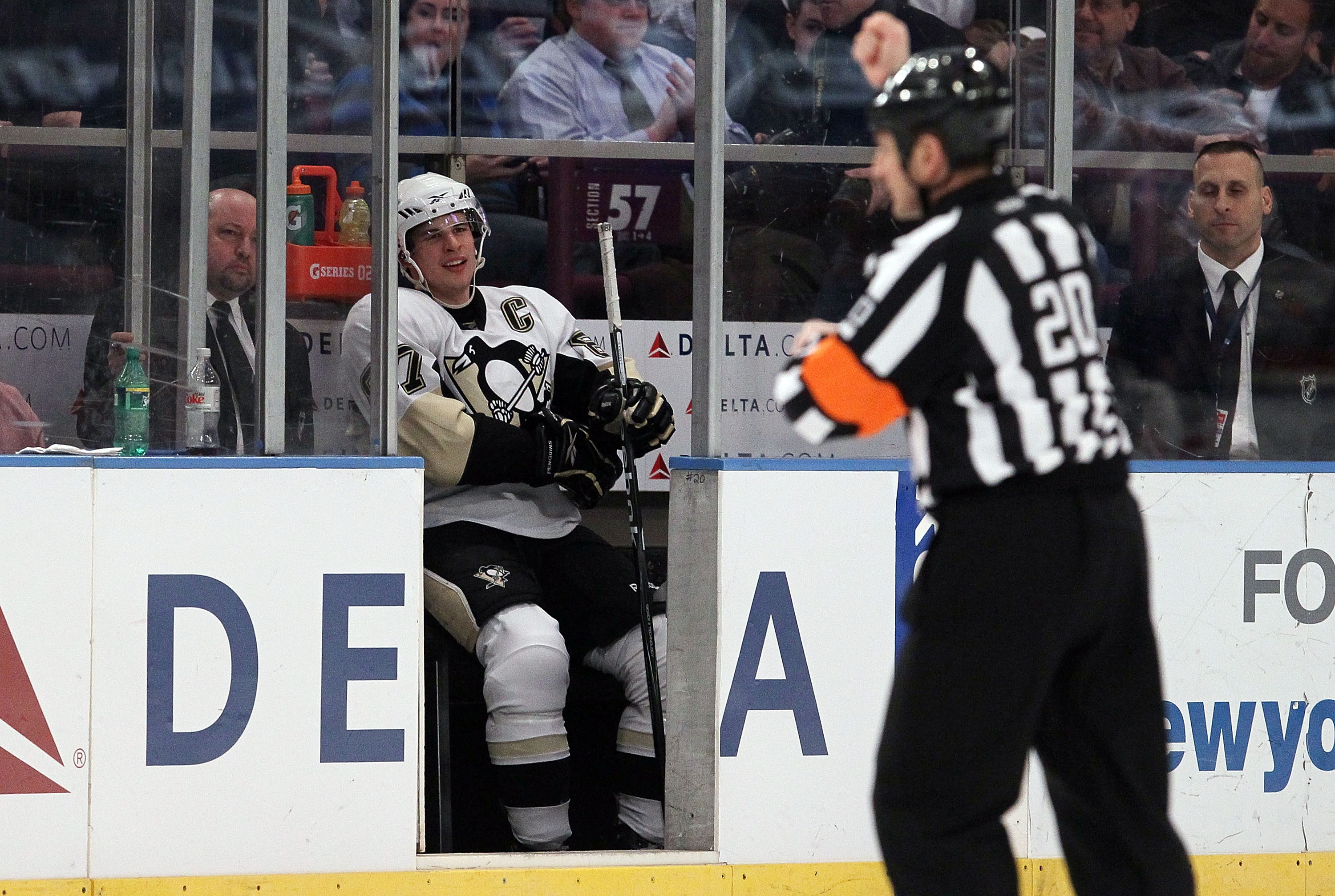 NEW YORK - MARCH 04:  Sidney Crosby #87 of the Pittsburgh Penguins sits in the penalty box against the New York Rangers after referee Tim Peel makes a holding call on March 4, 2010 at Madison Square Garden in New York City.  (Photo by Jim McIsaac/Getty Im