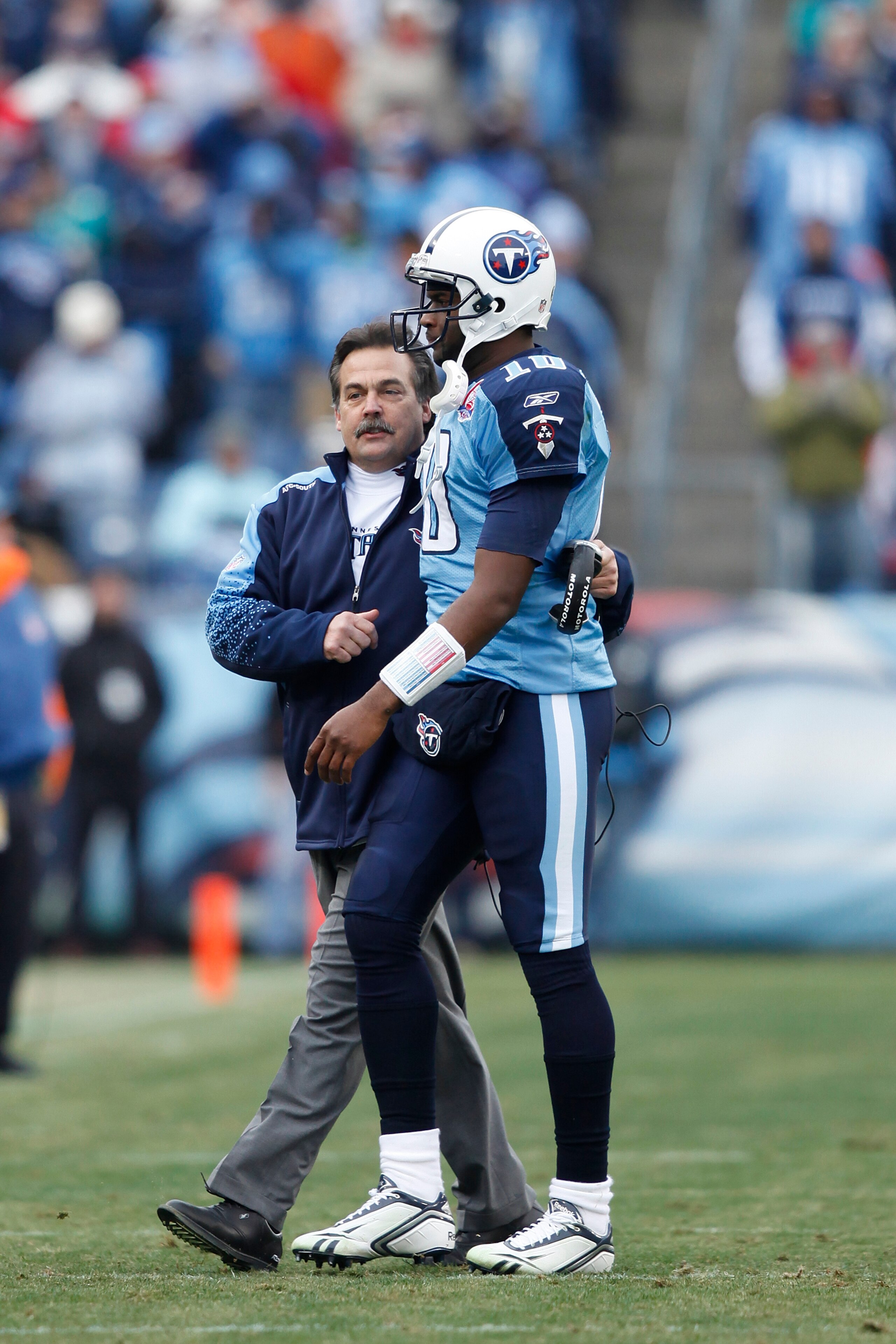 NASHVILLE, TN - DECEMBER 20: Head coach Jeff Fisher of the Tennessee Titans talks with Vince Young #10 after he threw a touchdown pass against the Miami Dolphins at LP Field on December 20, 2009 in Nashville, Tennessee. The Titans defeated the Dolphins 27