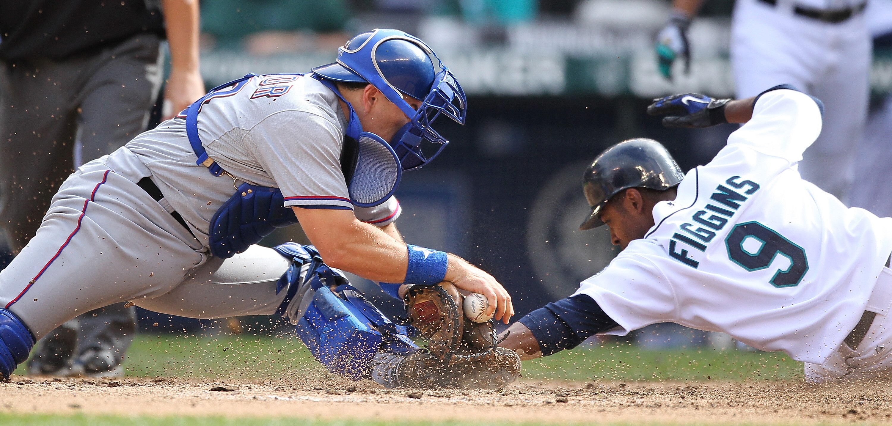 SEATTLE - SEPTEMBER 19:  Chone Figgins #9 of the Seattle Mariners scores against catcher Matt Treanor #20 of the Texas Rangers on a double by Franklin Gutierrez #21 in the sixth inning at Safeco Field on September 19, 2010 in Seattle, Washington. (Photo b