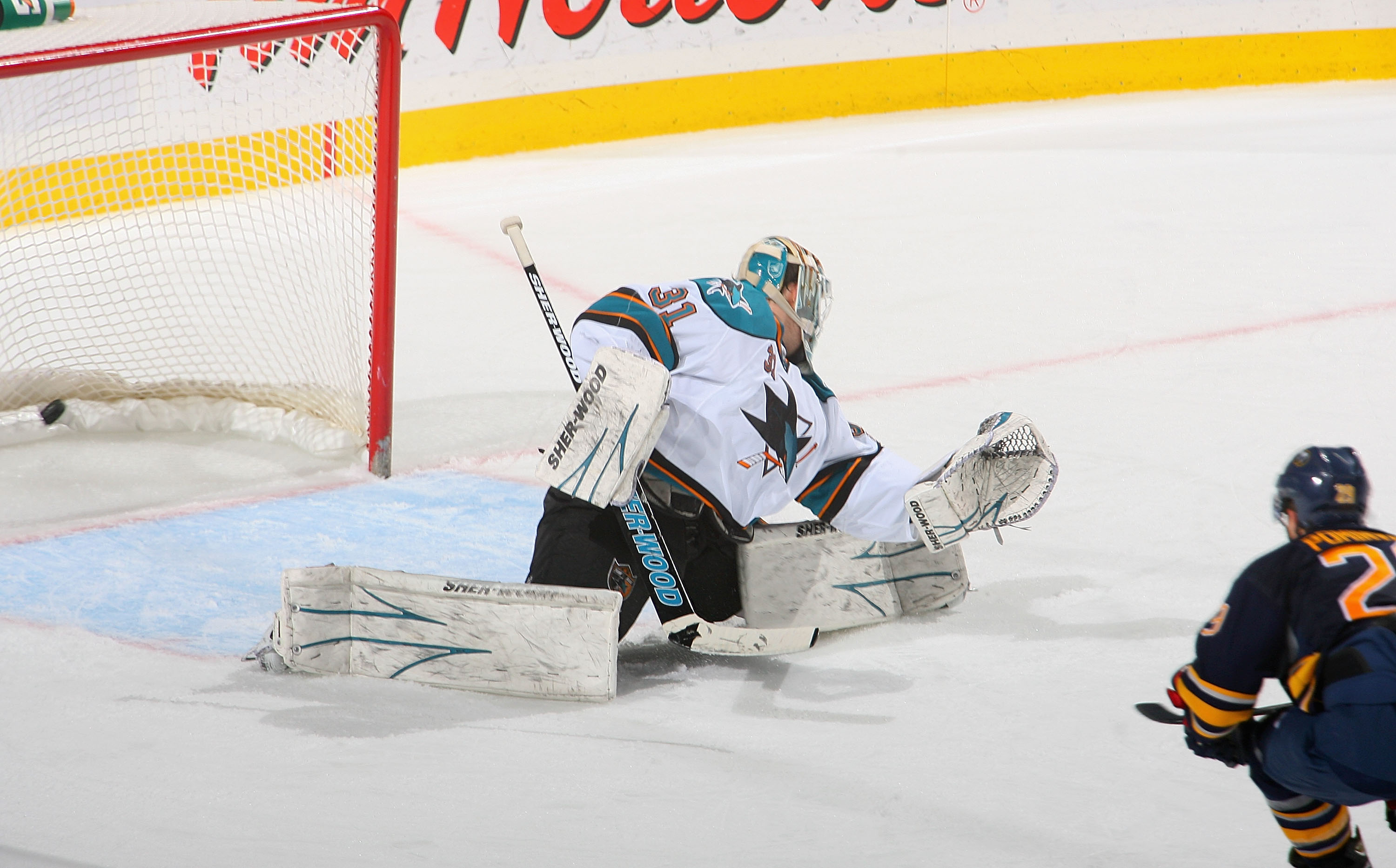 BUFFALO, NY - DECEMBER 09: Jason Pominville #29 of the Buffalo Sabres scores a shorthanded goal on Antti Niemi #31 of the San Jose Sharks at HSBC Arena on December 9, 2010 in Buffalo, New York.  (Photo by Rick Stewart/Getty Images)