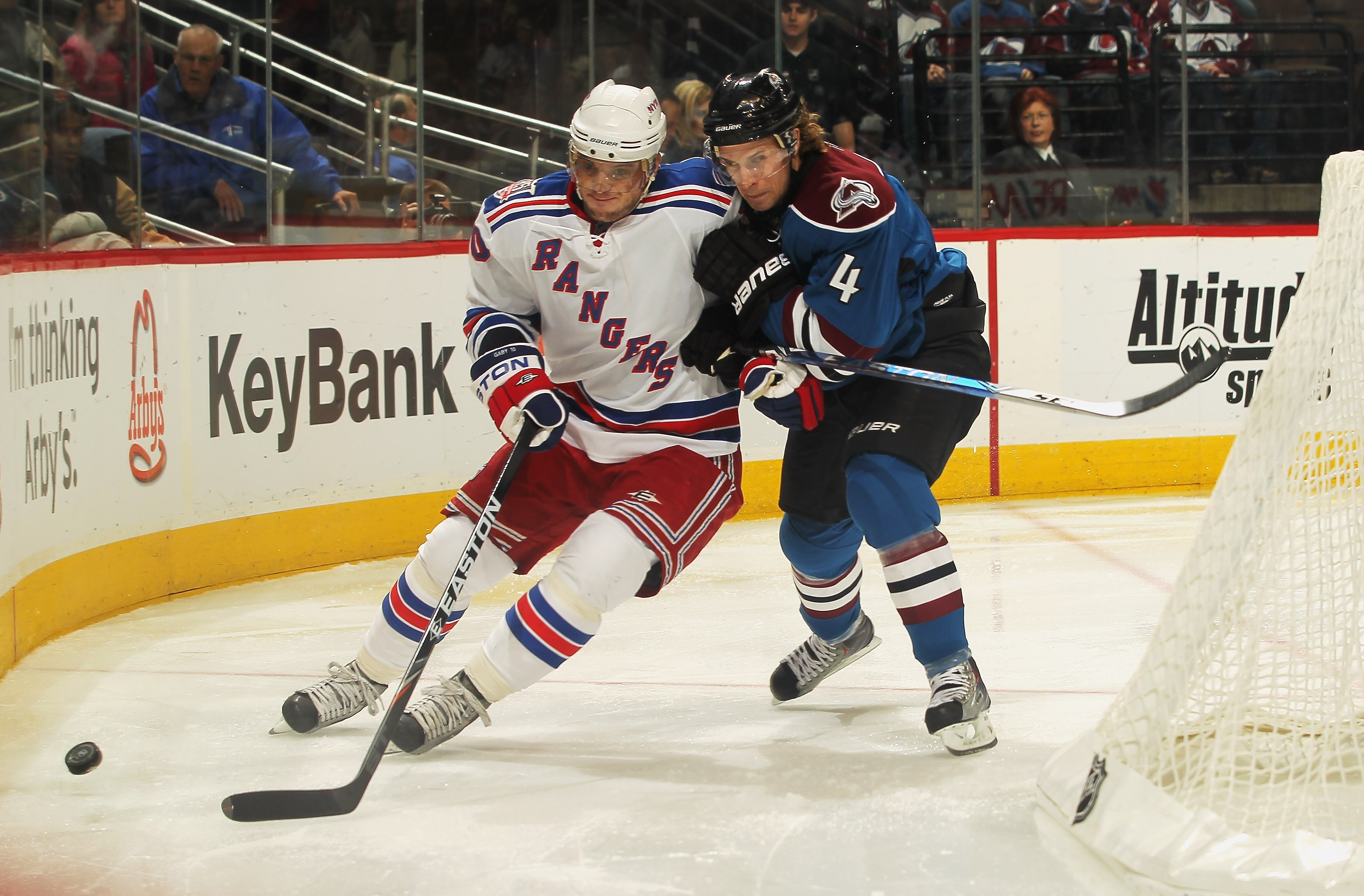 DENVER - NOVEMBER 19:  John-Michael Liles #4 of the Colorado Avalanche and Marian Gaborik #10 of the New York Rangers vie for the puck at the Pepsi Center on November 19, 2010 in Denver, Colorado. The Avalanche defeated the Rangers 5-1.  (Photo by Doug Pe