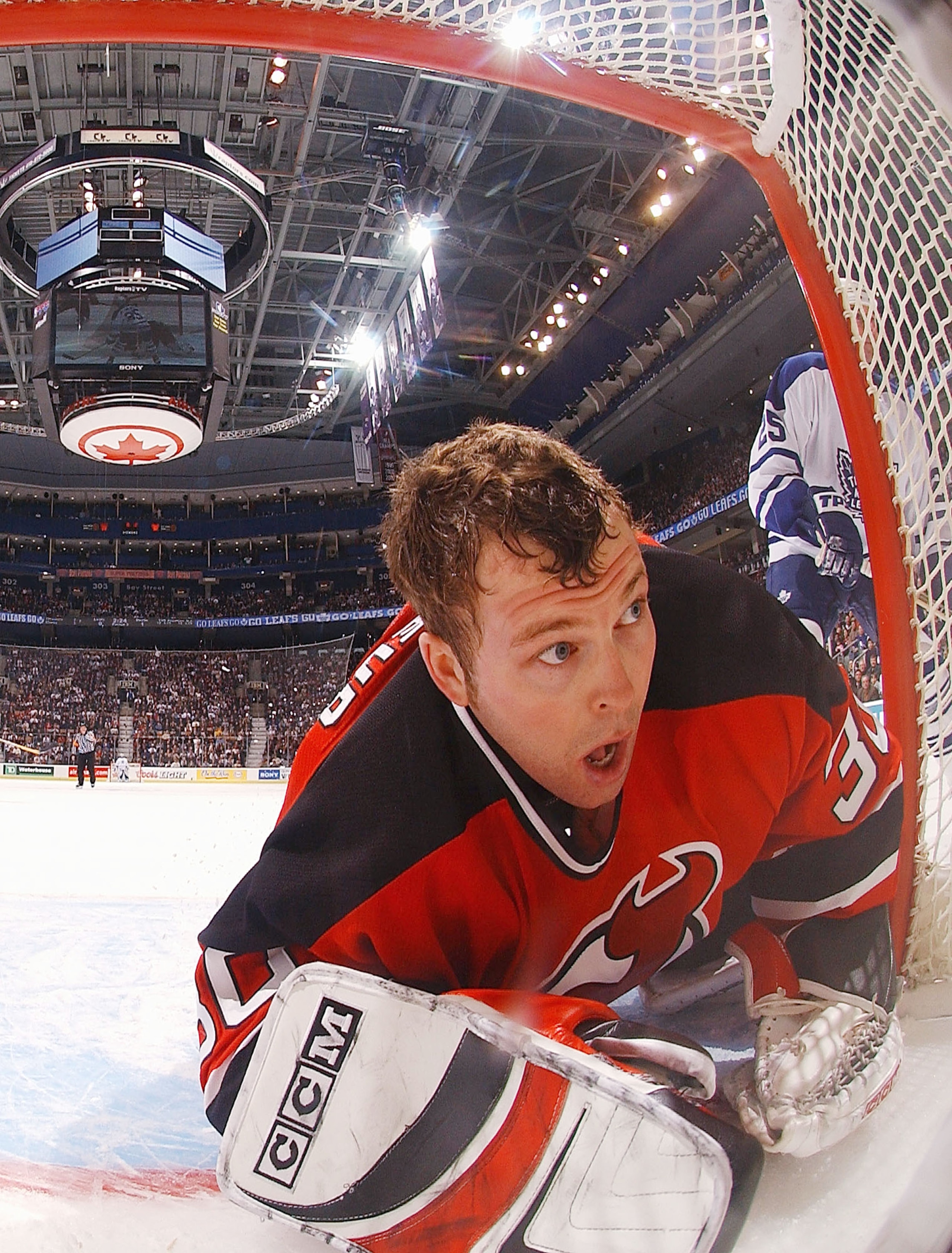 TORONTO - JANUARY 10:  Martin Brodeur #30 of the New Jersey Devils keeps his eye on the play after losing his helmet during a game against the Toronto Maple Leafs at Air Canada Centre on January 10, 2004 in Toronto, Ontario. (Photo By Dave Sandford/Getty
