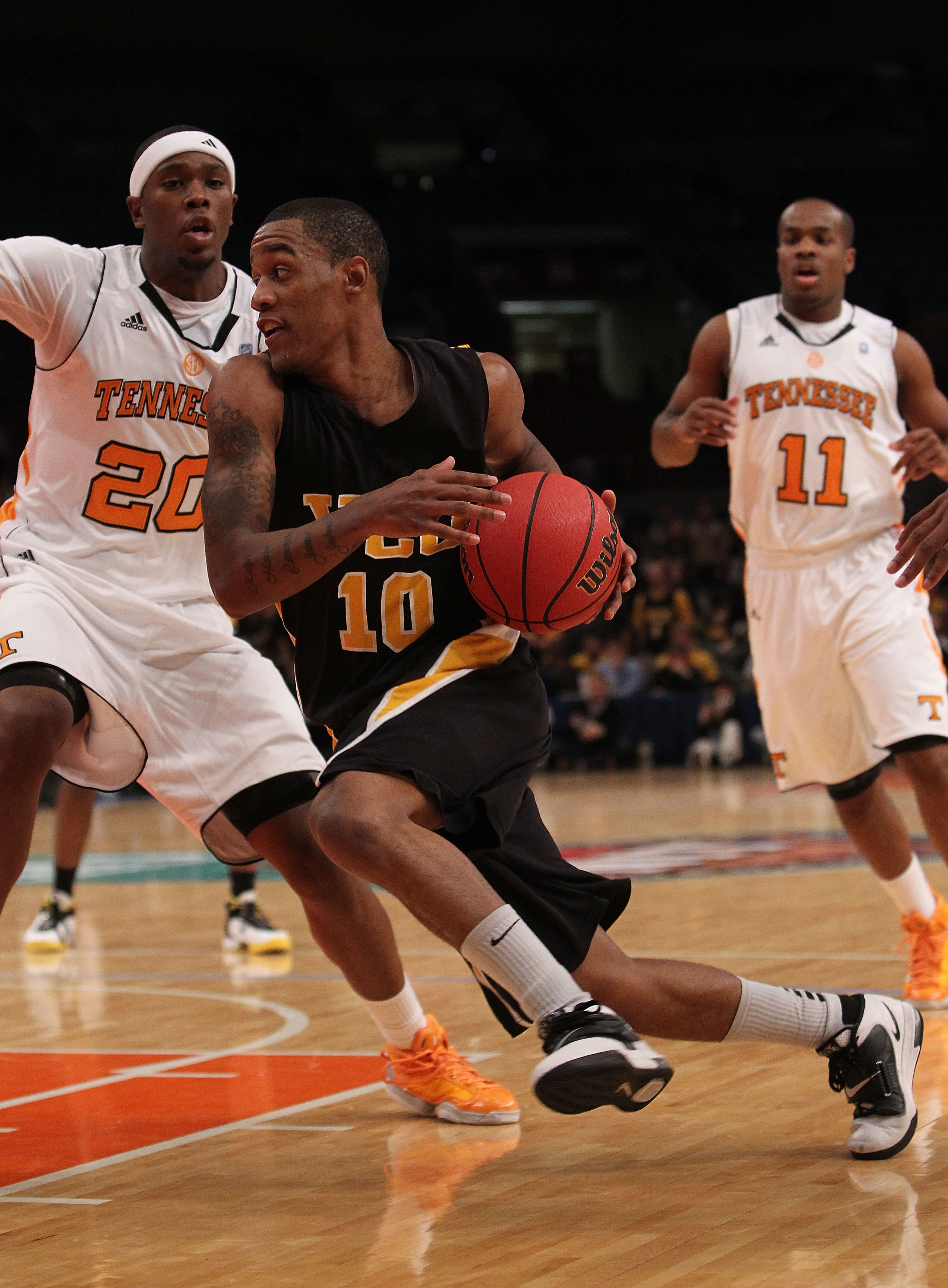 NEW YORK - NOVEMBER 24:  Darius Theus #10 of the Virginia Commonwealth Rams drives to the basket against the Tennessee Volunteers during their preseason NIT semifinal at Madison Square Garden on November 24, 2010 in New York City.  (Photo by Nick Laham/Ge