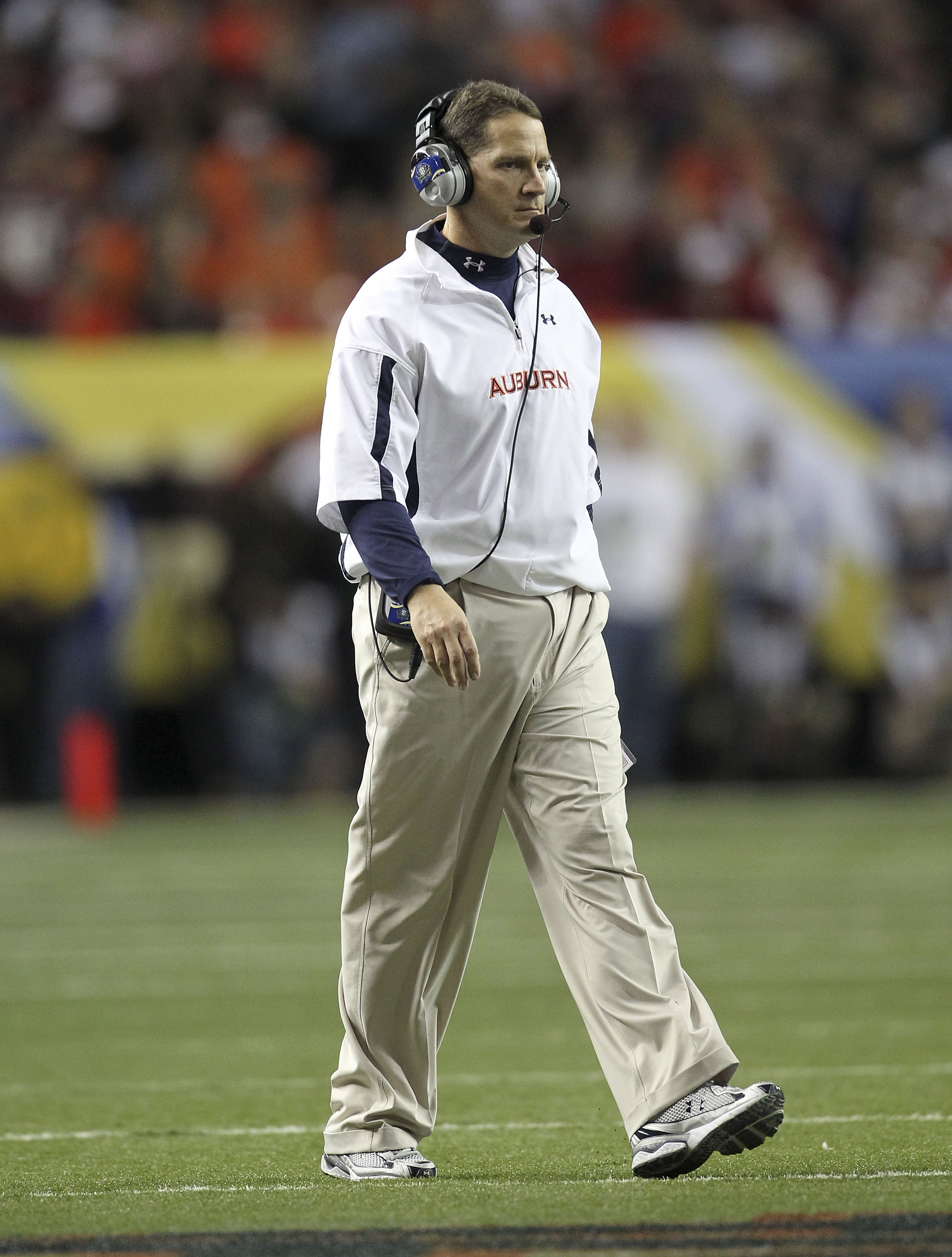 ATLANTA - DECEMBER 4:  Head coach Gene Chizik of the Auburn Tigers walks on the field during a timeout during the 2010 SEC Championship against the South Carolina Gamecocks at Georgia Dome on December 4, 2010 in Atlanta, Georgia. (Photo by Mike Zarrilli/G
