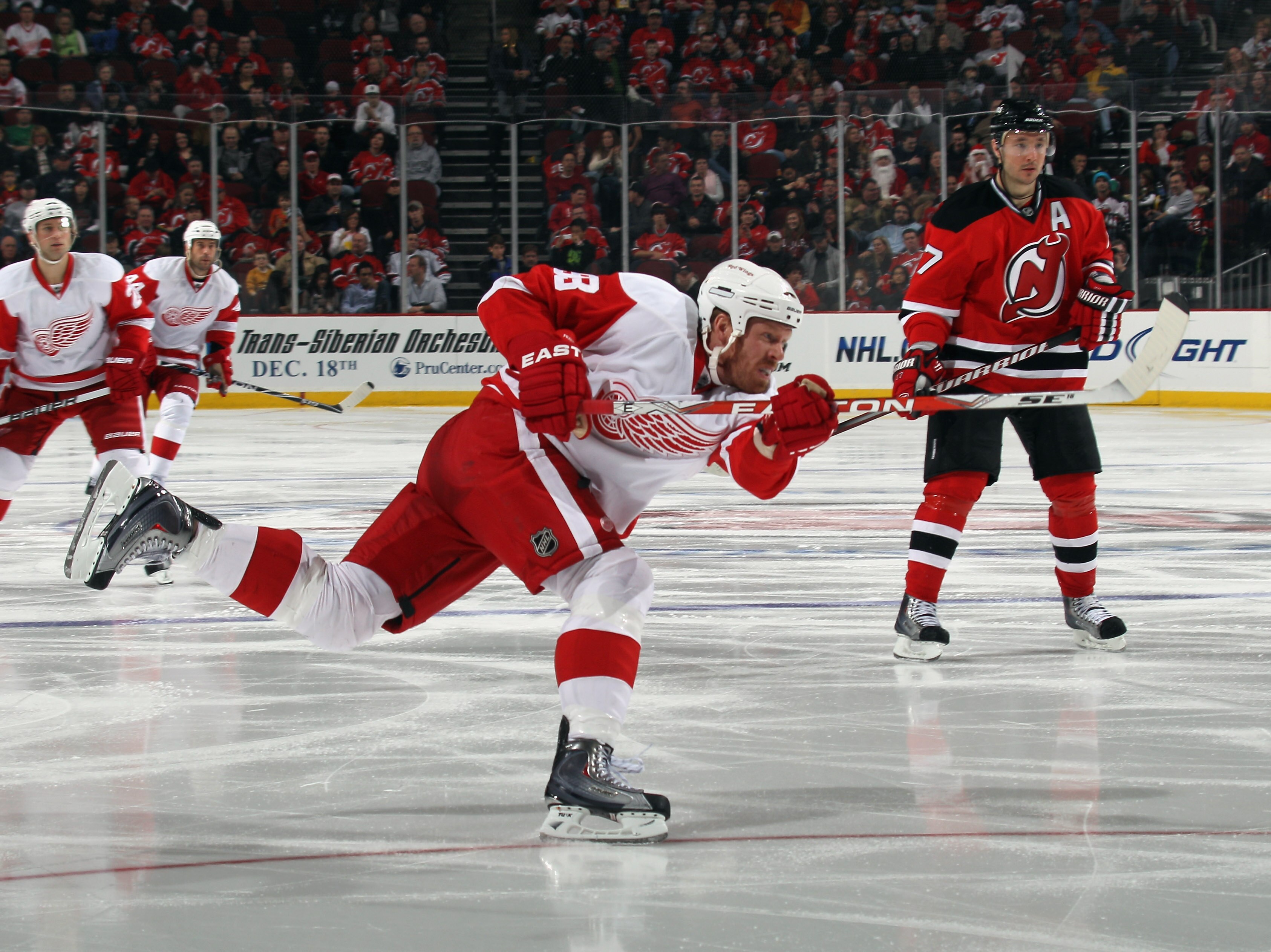 NEWARK, NJ - DECEMBER 11:  Johan Franzen #93 of the Detroit Red Wings skates against the New Jersey Devils at the Prudential Center on December 11, 2010 in Newark, New Jersey. The Red Wings defeated the the Devils 4-1.  (Photo by Bruce Bennett/Getty Image