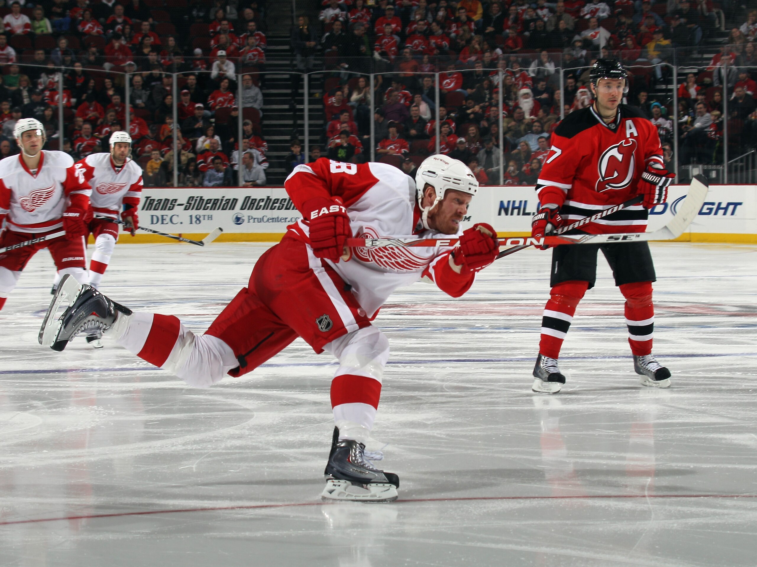 NEWARK, NJ - DECEMBER 11:  Johan Franzen #93 of the Detroit Red Wings skates against the New Jersey Devils at the Prudential Center on December 11, 2010 in Newark, New Jersey. The Red Wings defeated the the Devils 4-1.  (Photo by Bruce Bennett/Getty Image