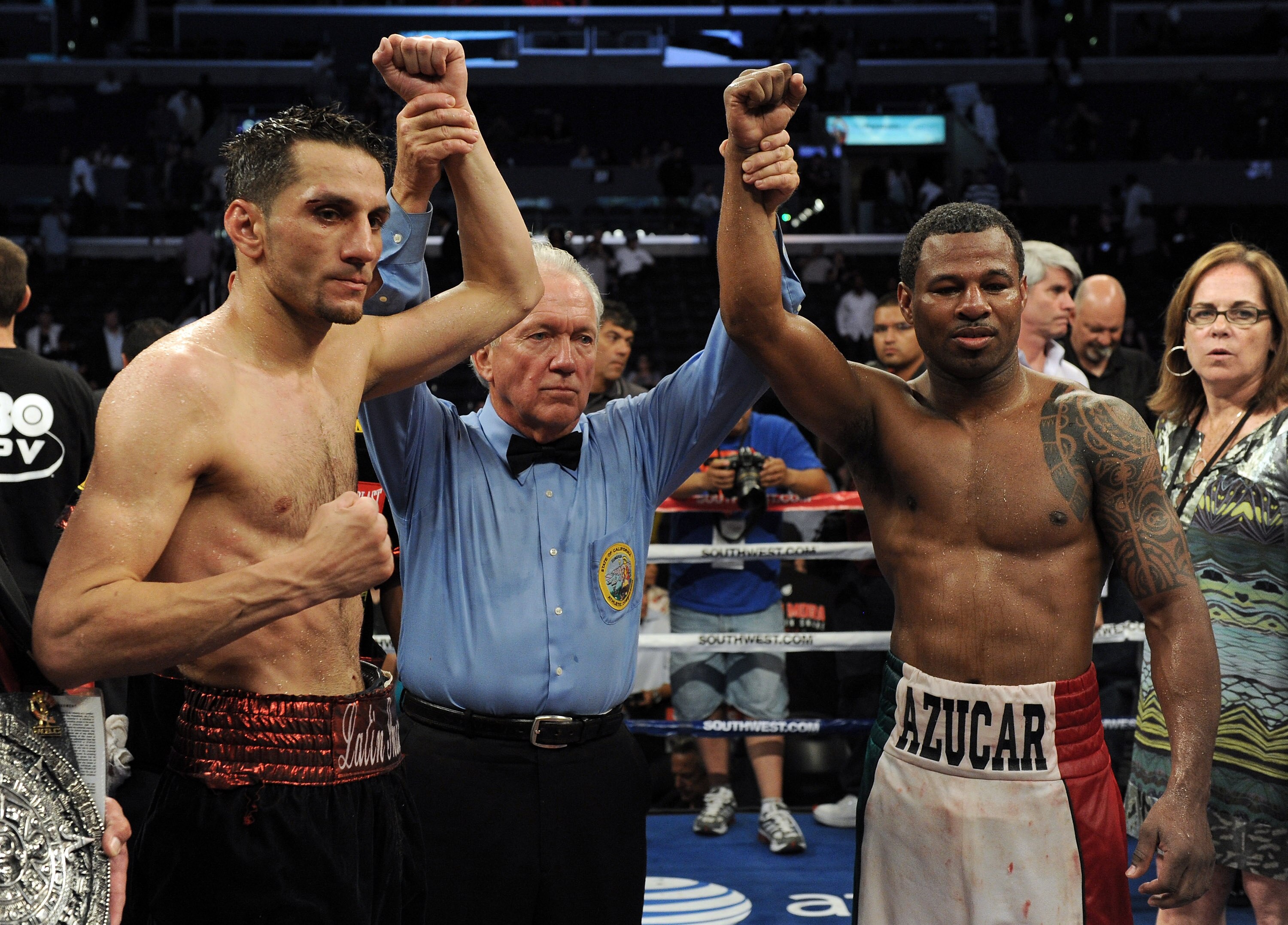 LOS ANGELES, CA - SEPTEMBER 18:  Referee Pat Russell poses with Shane Mosley and Sergio Mora after the Middleweight bout at Staples Center on September 18, 2010 in Los Angeles, California.  The fight ended in a draw.  (Photo by Harry How/Getty Images)