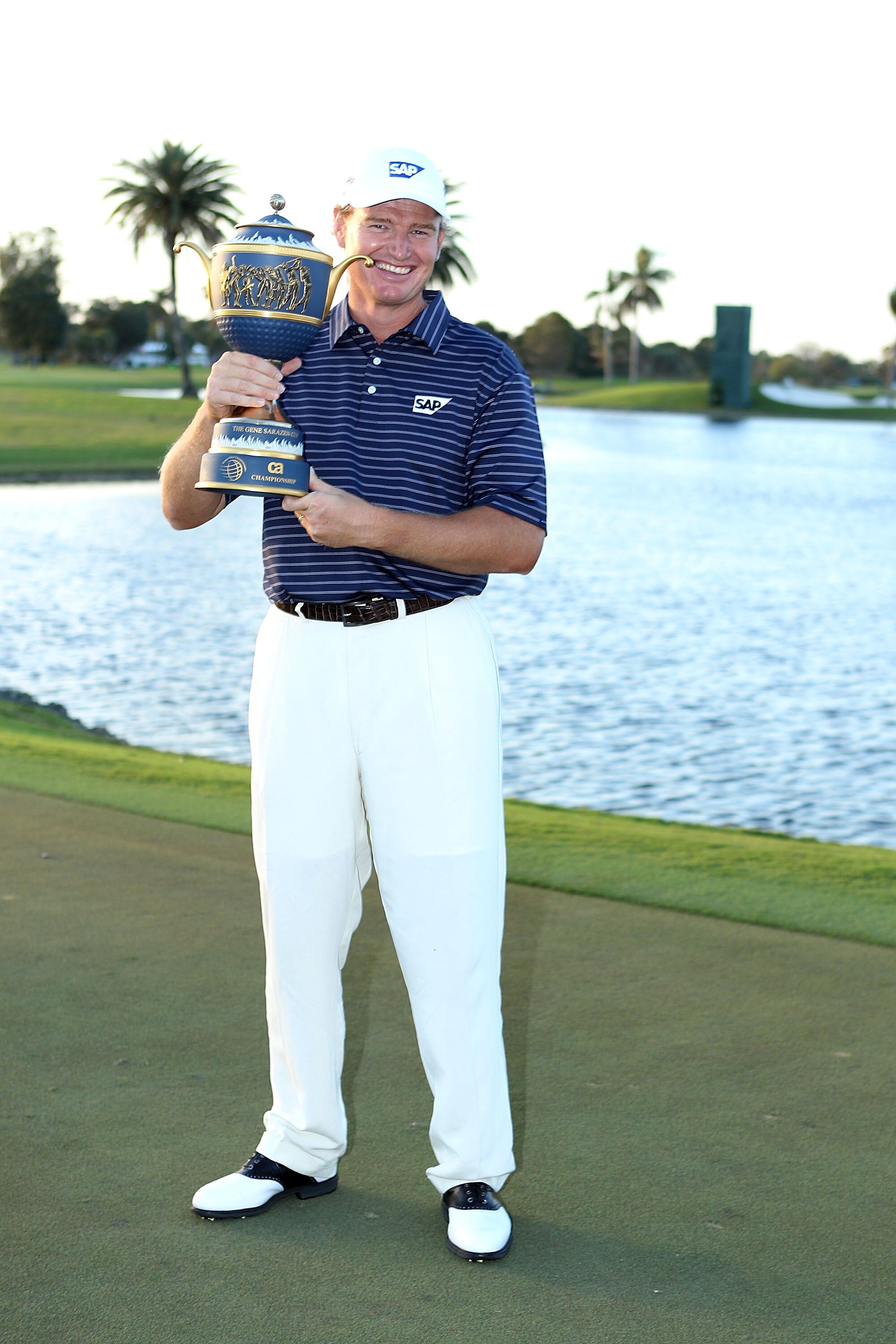 DORAL, FL - MARCH 14:  Ernie Els of South Africa lifts the Gene Sarazen Cup trophy on the 18th hole after winning the 2010 WGC-CA Championship at the TPC Blue Monster at Doral on March 14, 2010 in Doral, Florida.  (Photo by Scott Halleran/Getty Images)