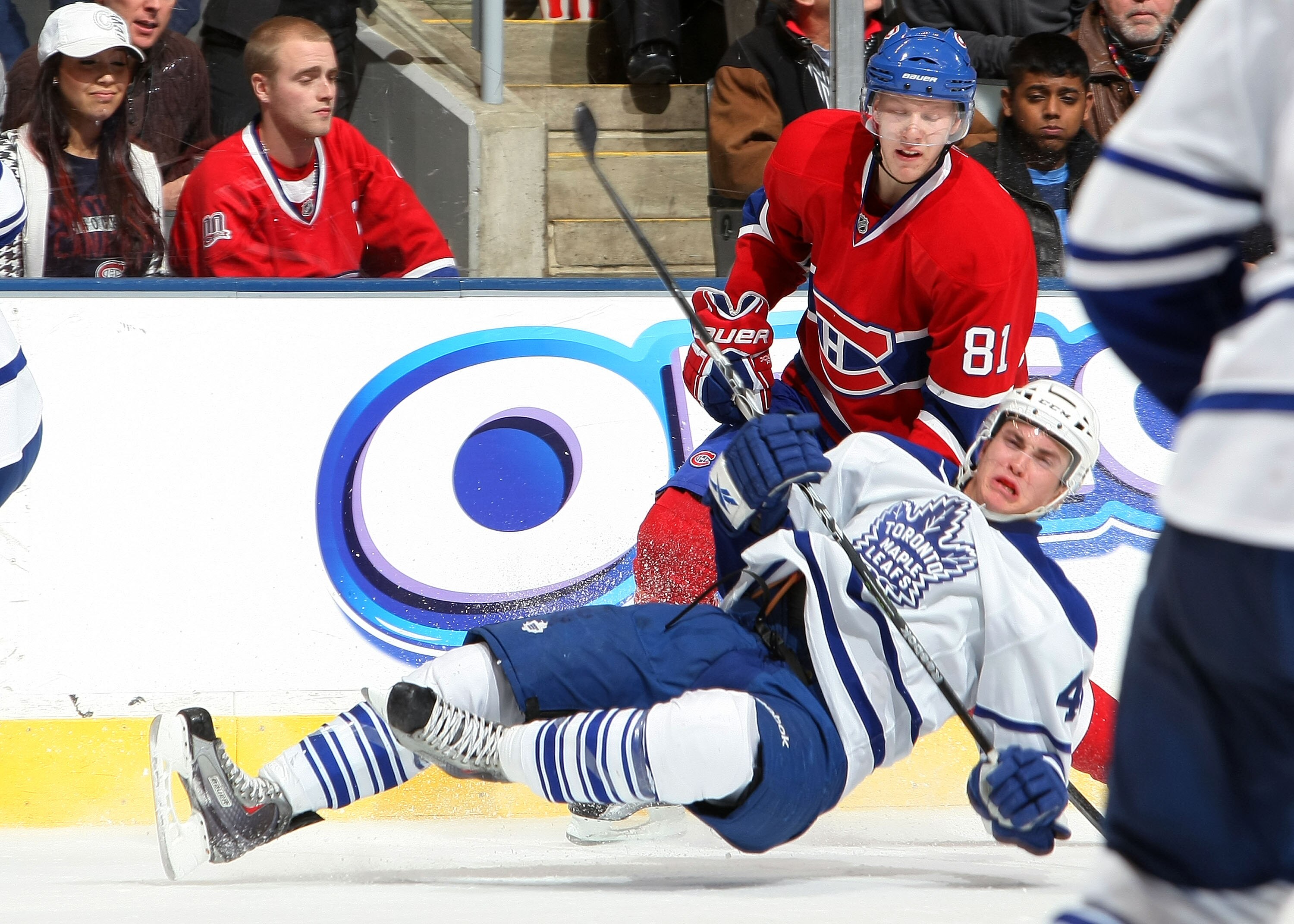 TORONTO - DECEMBER 11:  Tyler Bozak #42 of the Toronto Maple Leafs is upended by Lars Eller #81 of the Montreal Canadiens during their NHL game at Air Canada Centre on December 11, 2010 in Toronto, Ontario, Canada.(Photo By Dave Sandford/Getty Images)