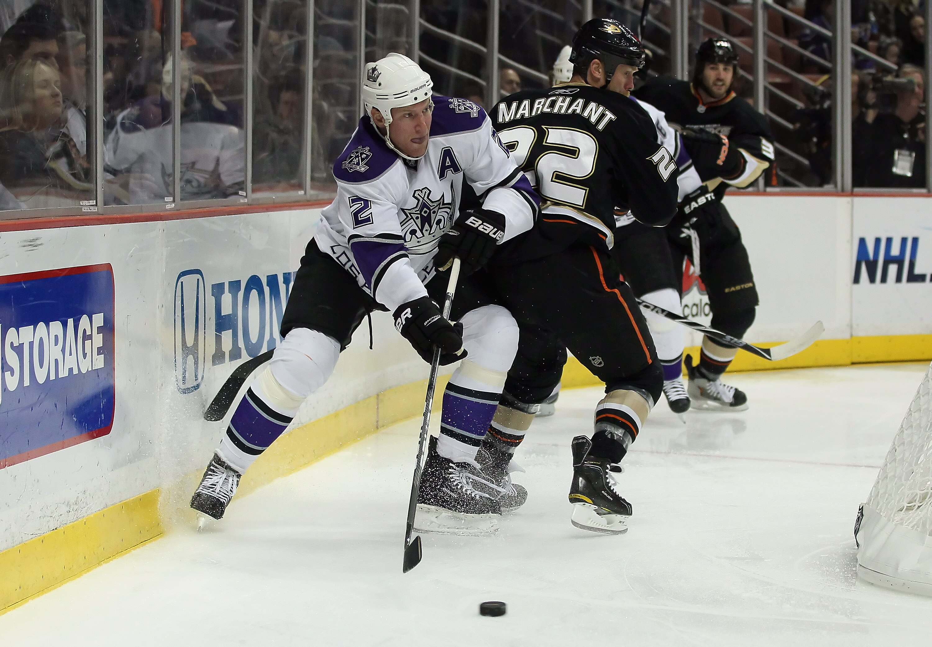 ANAHEIM, CA - NOVEMBER 29:  Matt Greene #2 of the Los Angeles Kings skates around Todd Marchant #22 of the Anaheim Ducks at the Honda Center on November 29, 2010 in Anaheim, California.  (Photo by Jeff Gross/Getty Images)