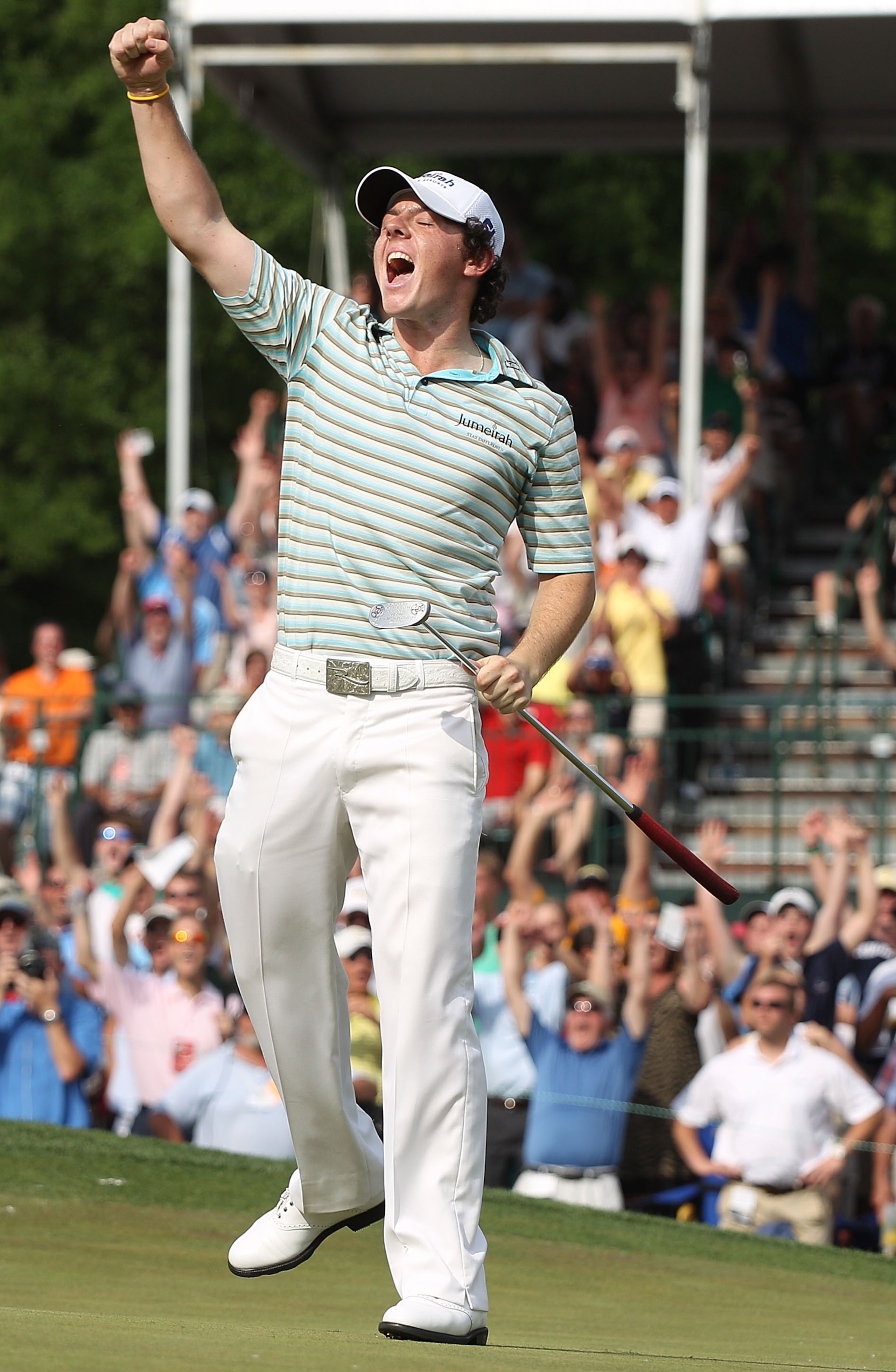 CHARLOTTE, NC - MAY 02:  Rory McIlroy of Northern Ireland celebrates as he holes a birdie putt on the 18th green to secure victory during the final round of the 2010 Quail Hollow Championship at the Quail Hollow Club on May 2, 2010 in Charlotte, North Car