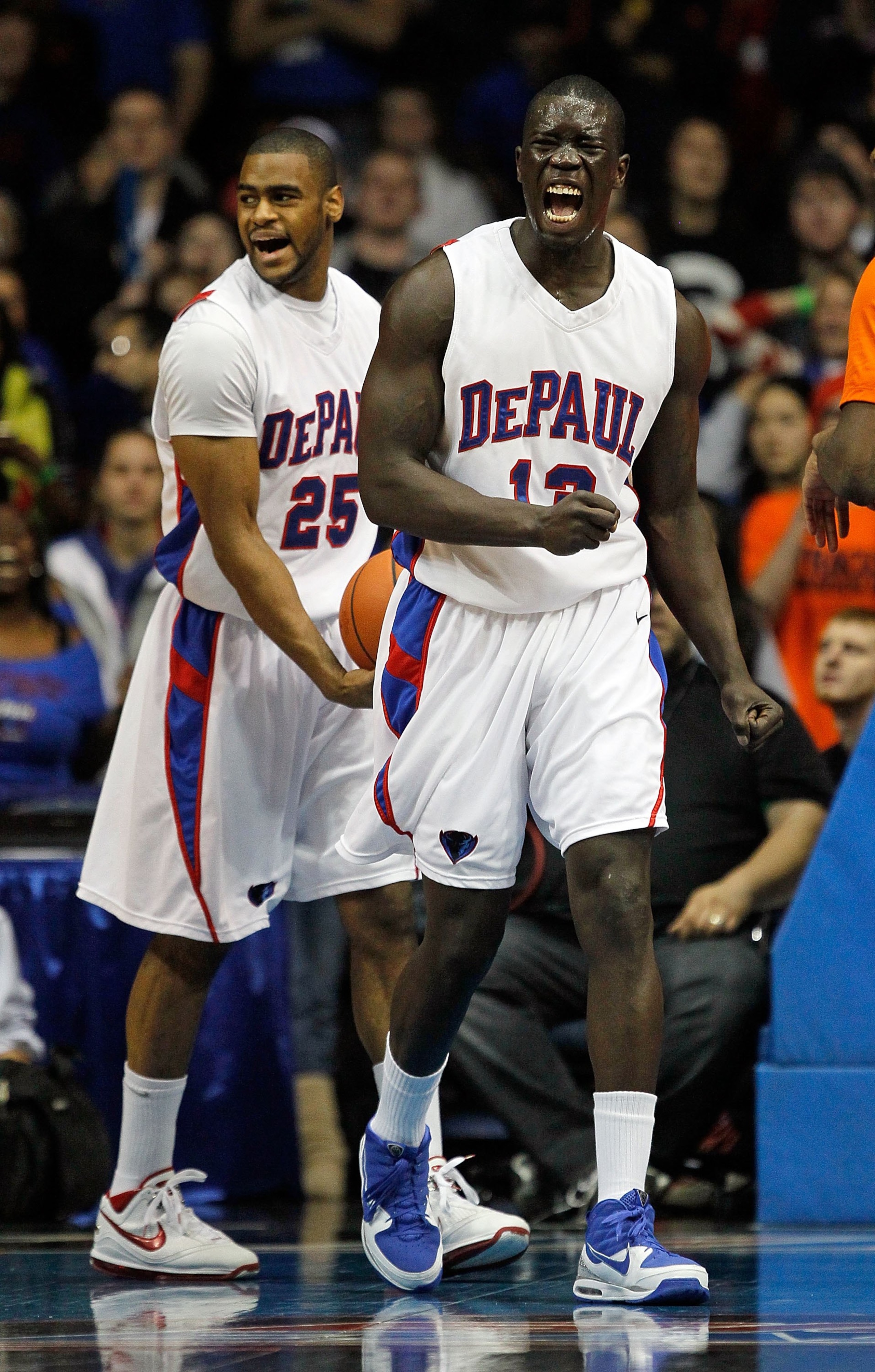 ROSEMONT, IL - JANUARY 30: Mac Koshwal #13 and Eric Wallace #25 of the DePaul Blue Demons yell after a foul is called against the Syracuse Orange at the Allstate Arena on January 30, 2010 in Rosemont, Illinois. Syracuse defeated DePaul 59-57. (Photo by Jo