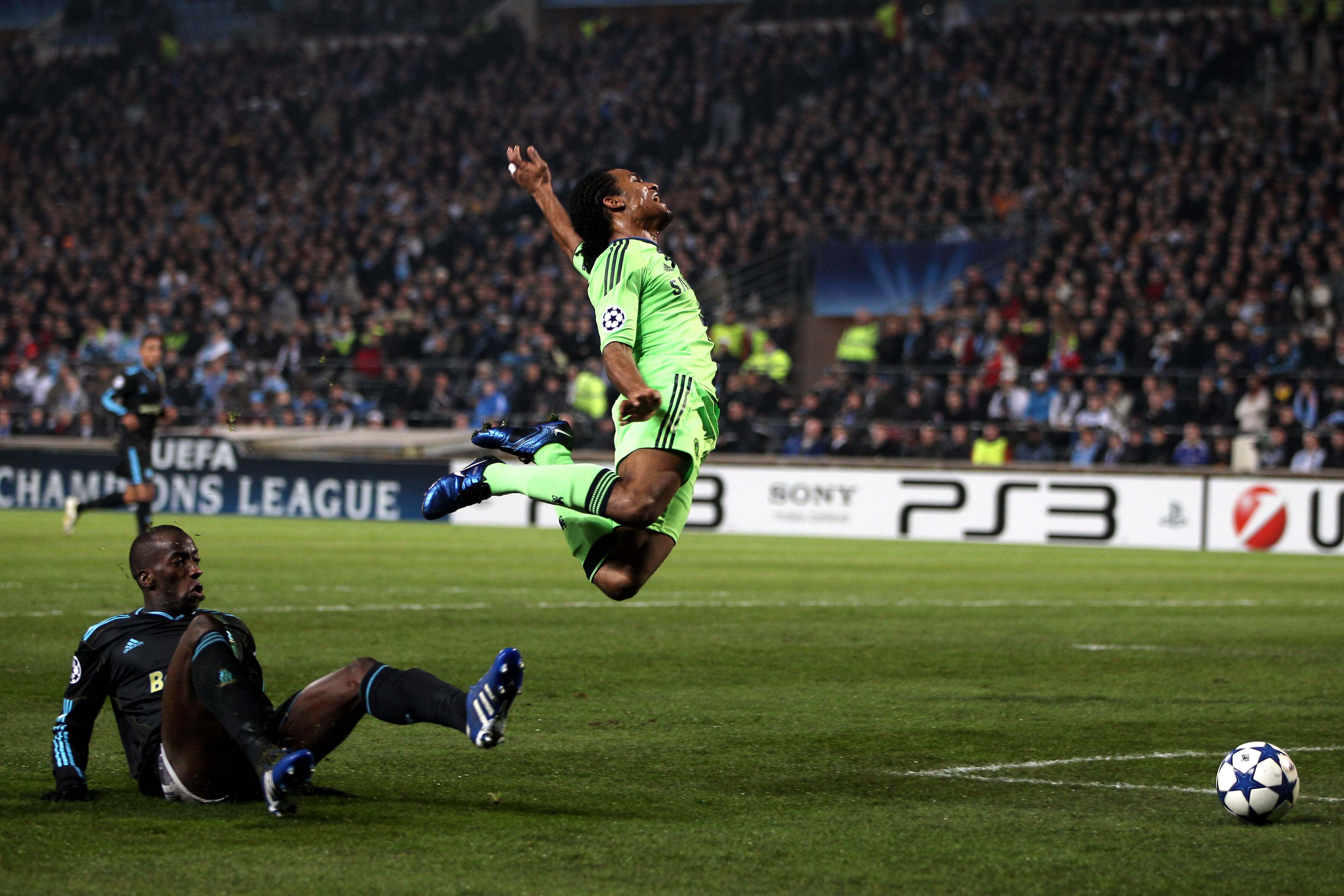 MARSEILLE, FRANCE - DECEMBER 08:  Florent Malouda of Chelsea is brought down in the area by Souleymane Diawara of Marseille, but Referee Vladislav Bezborodov of Russia refuses to award the penalty during the UEFA Champions League Group F match between Mar