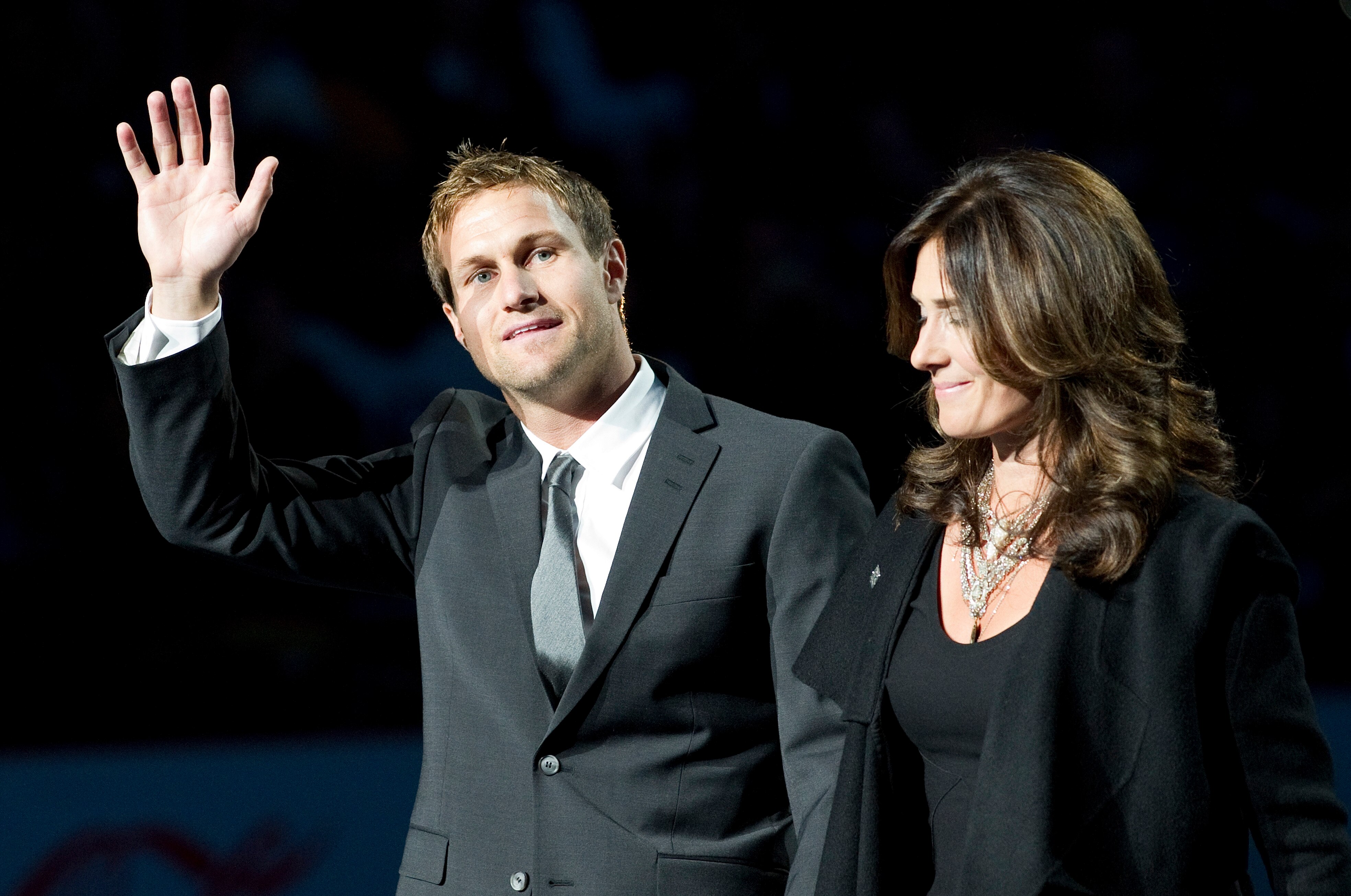 VANCOUVER, CANADA - DECEMBER 11: Markus Naslund and his wife Lotta wave to the crowd during a ceremony to retire his jersey prior to NHL action on December 11, 2010 against the Tampa Bay Lightning and the Vancouver Canucks at Rogers Arena in Vancouver, BC