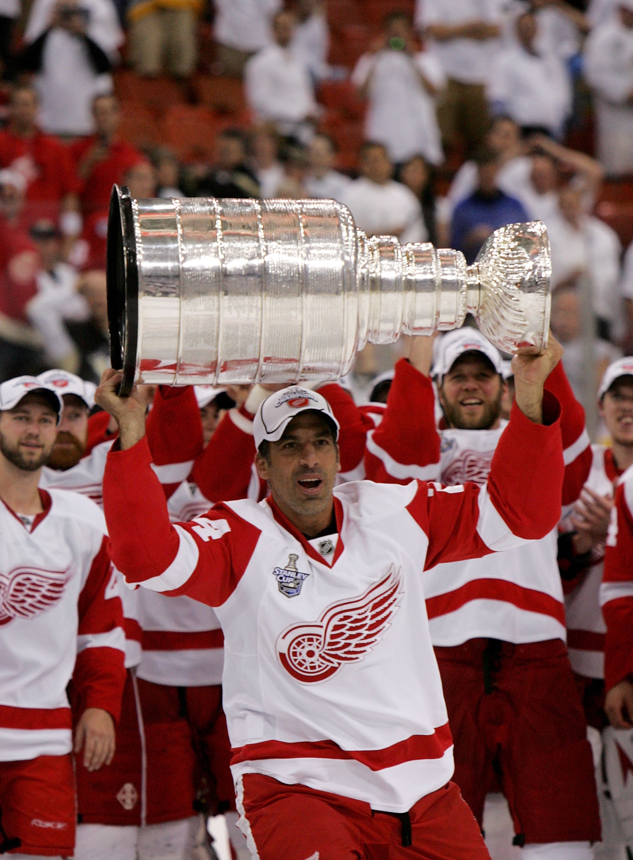 PITTSBURGH - JUNE 04:  Chris Chelios #24 of the Detroit Red Wings celebrates with the Stanley Cup after defeating the Pittsburgh Penguins in game six of the 2008 NHL Stanley Cup Finals at Mellon Arena on June 4, 2008 in Pittsburgh. Pennsylvania. The Red W