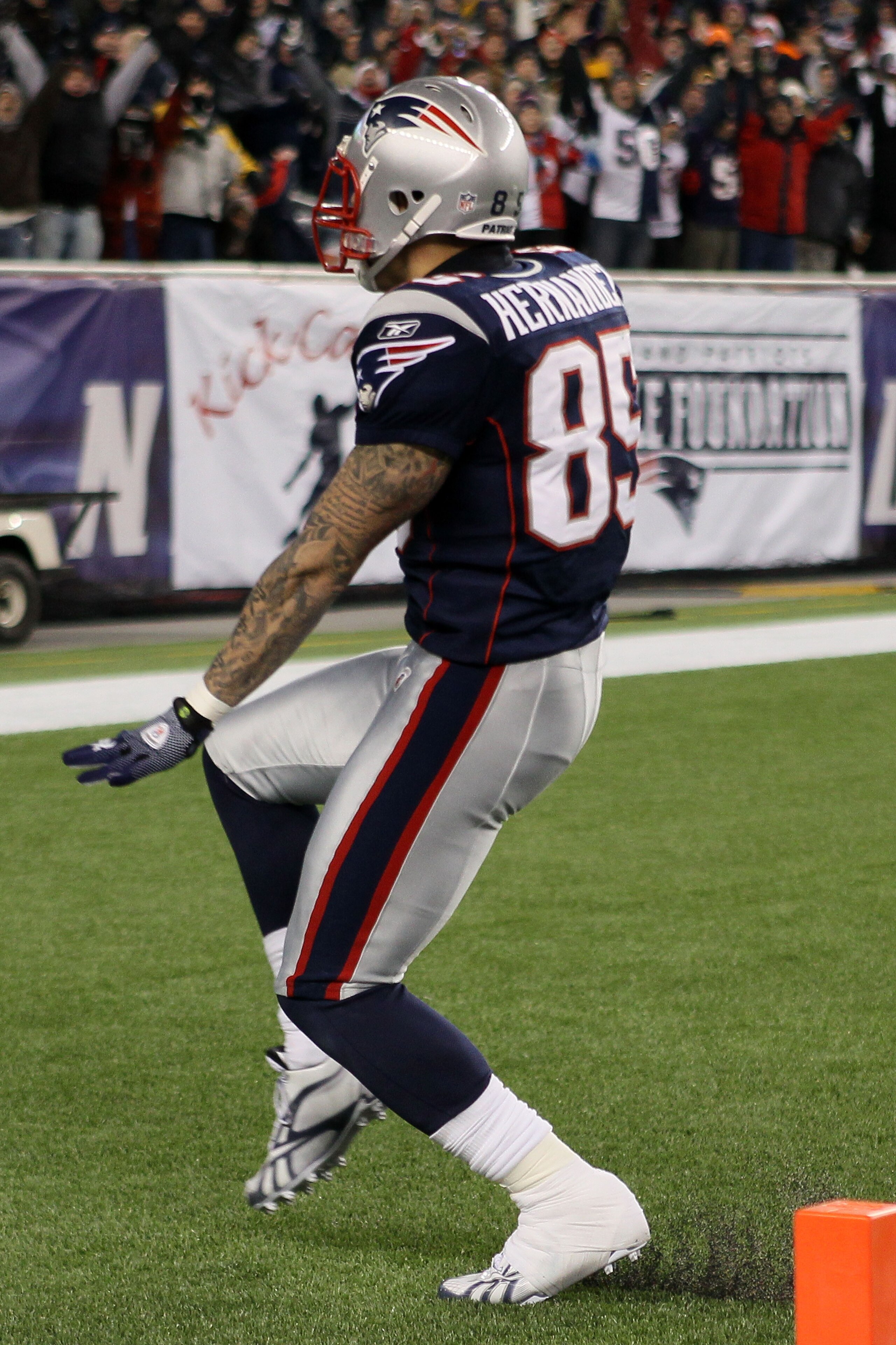 FOXBORO, MA - DECEMBER 19:  Tight end Aaron Hernandez #85 of the New England Patriots scores a touchdown after catching a pass from quarterback Tom Brady #12 (not pictured) in the fourth quarter of the game against the Green Bay Packers at Gillette Stadiu