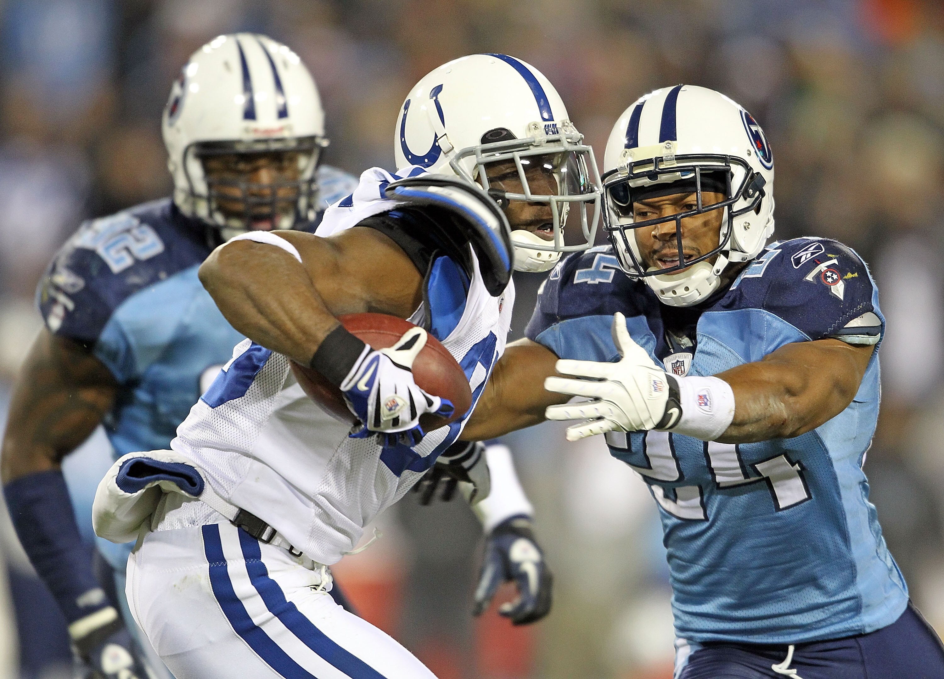 NASHVILLE, TN - DECEMBER 09:  Pierre Garcon #85 of the Indianapolis Colts runs with the ball after a reception while defended by Chris Hope #24  of the Tennessee Titans during the NFL game at LP Field on December 9, 2010 in Nashville, Tennessee.  (Photo b