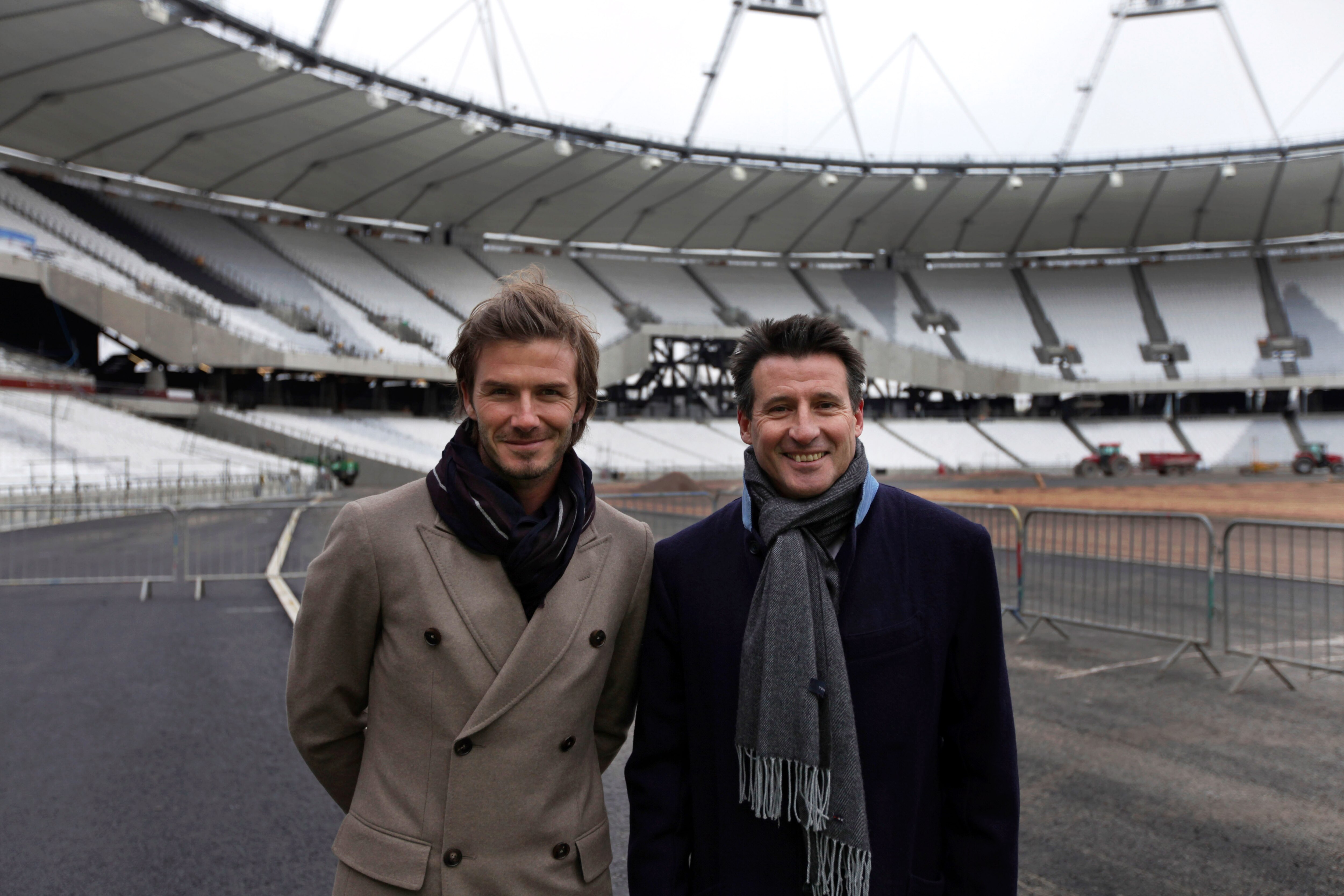 LONDON - NOVEMBER 29:  British football player David Beckham (L) is shown the main Olympic stadium by Lord Coe, Chair of the London 2012 Organising Committee, during a visit to the main Olympic stadium on November 29, 2010 in London, England.  The Olympic