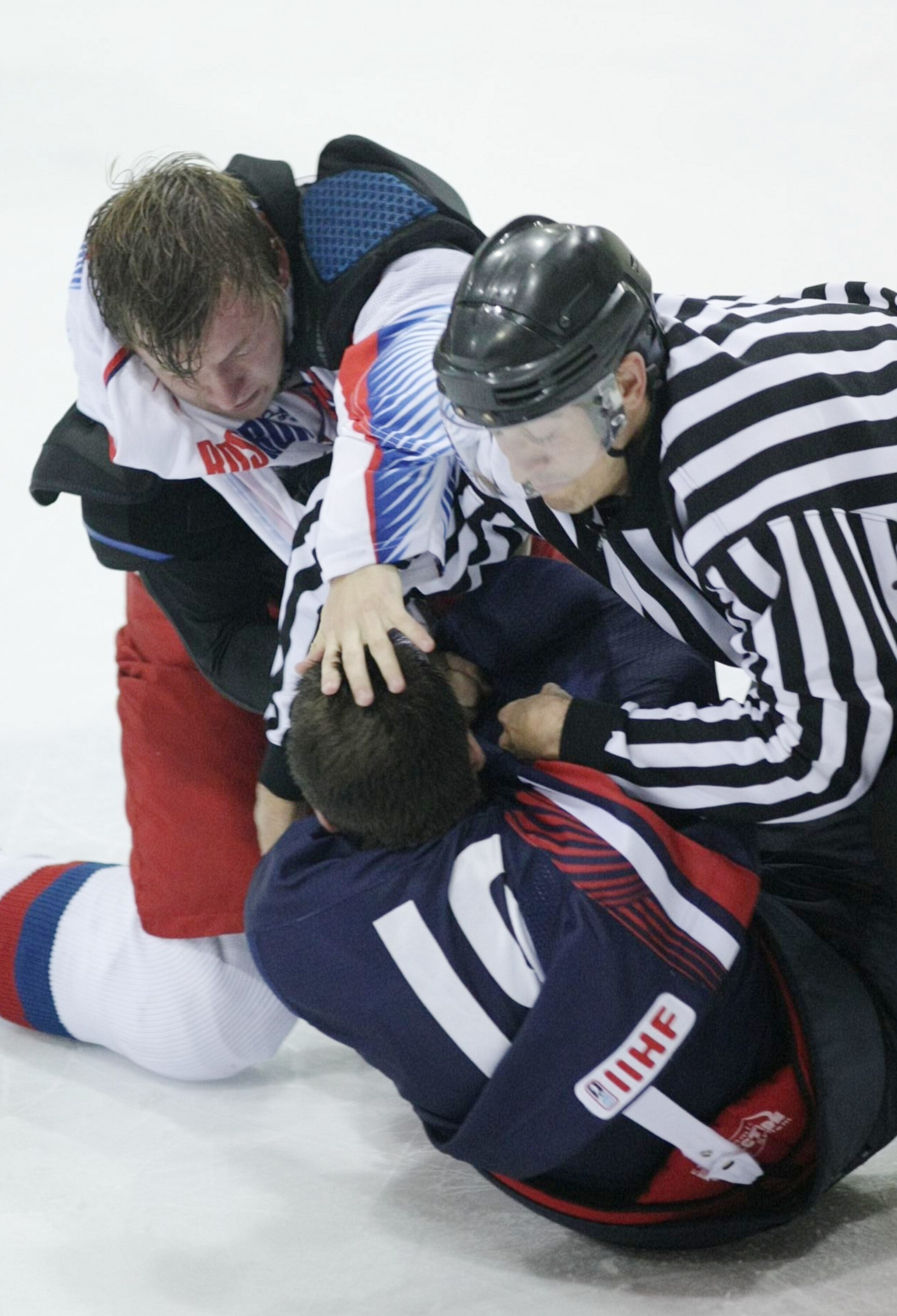 LAKE PLACID, NY - AUGUST 15:  Jeremy Morin #19 of Team USA and Vladimir Tarasenko #9 of Team Russia fight during the second period of the Under-20 game at the 1980 Rink Herb Brooks Arena on August 15, 2009 in Lake Placid, New York. (Photo by Bruce Bennett