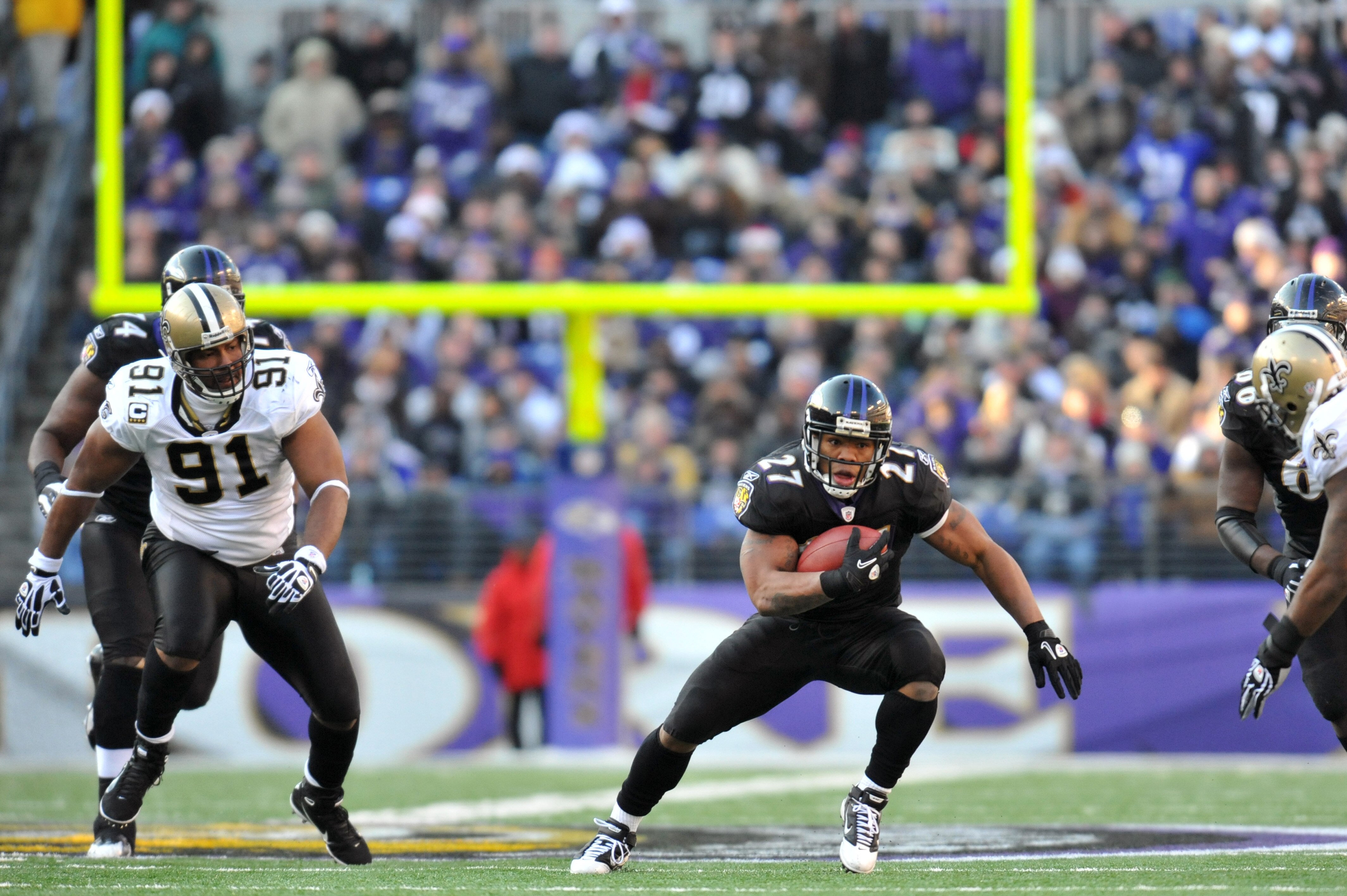 BALTIMORE, MD - DECEMBER 19:  Ray Rice #27 of the Baltimore Ravens runs the ball against the New Orleans Saints  at M&T Bank Stadium on December 19, 2010 in Baltimore, Maryland. The Ravens defeated the Saints 30-24. (Photo by Larry French/Getty Images)