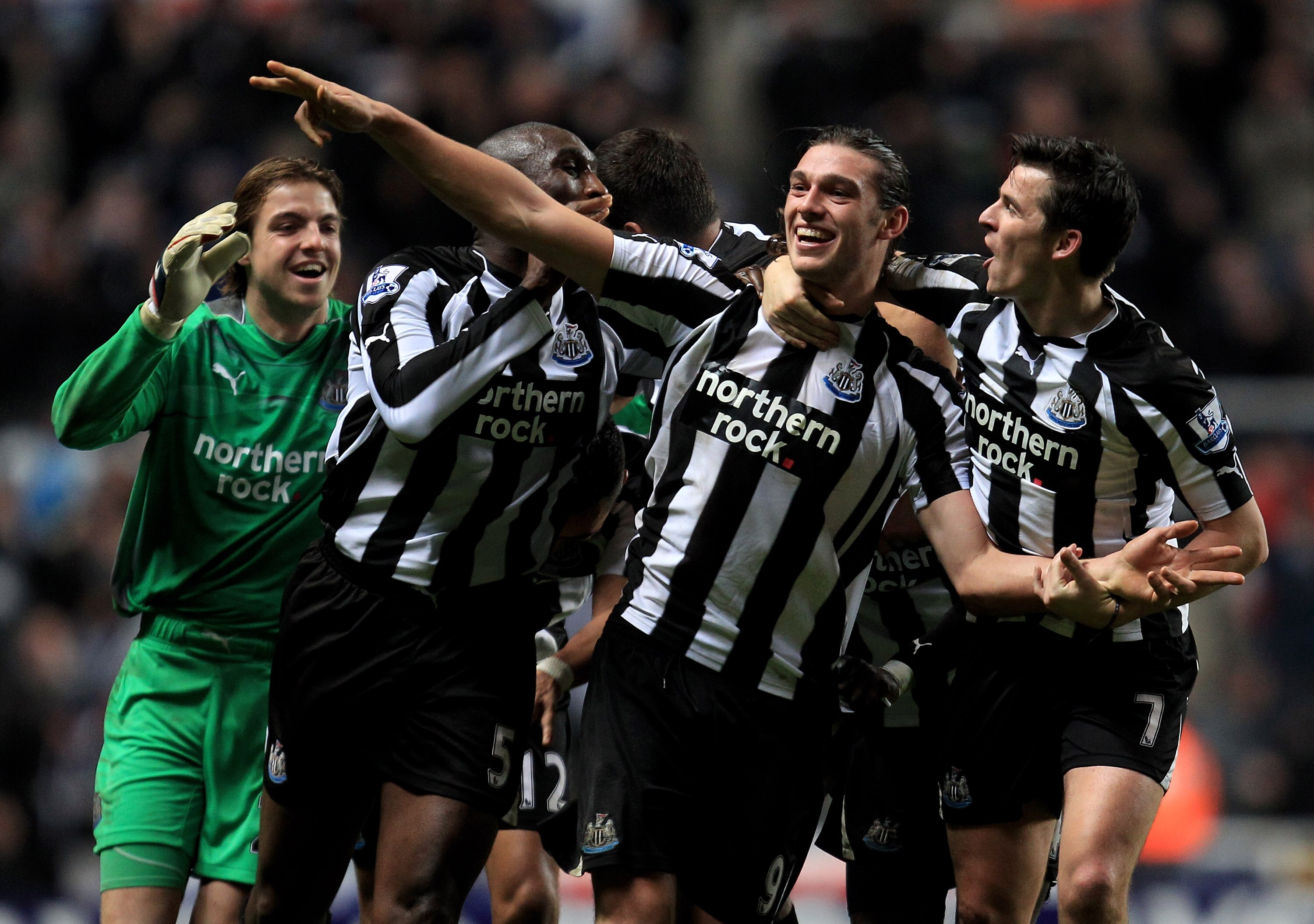 NEWCASTLE UPON TYNE, ENGLAND - DECEMBER 11:  Andy Carroll of Newcastle United celebrates scoring his team's third goal with his team mates during the Barclays Premier League match between Newcastle United and Liverpool at St James' Park on December 11, 20