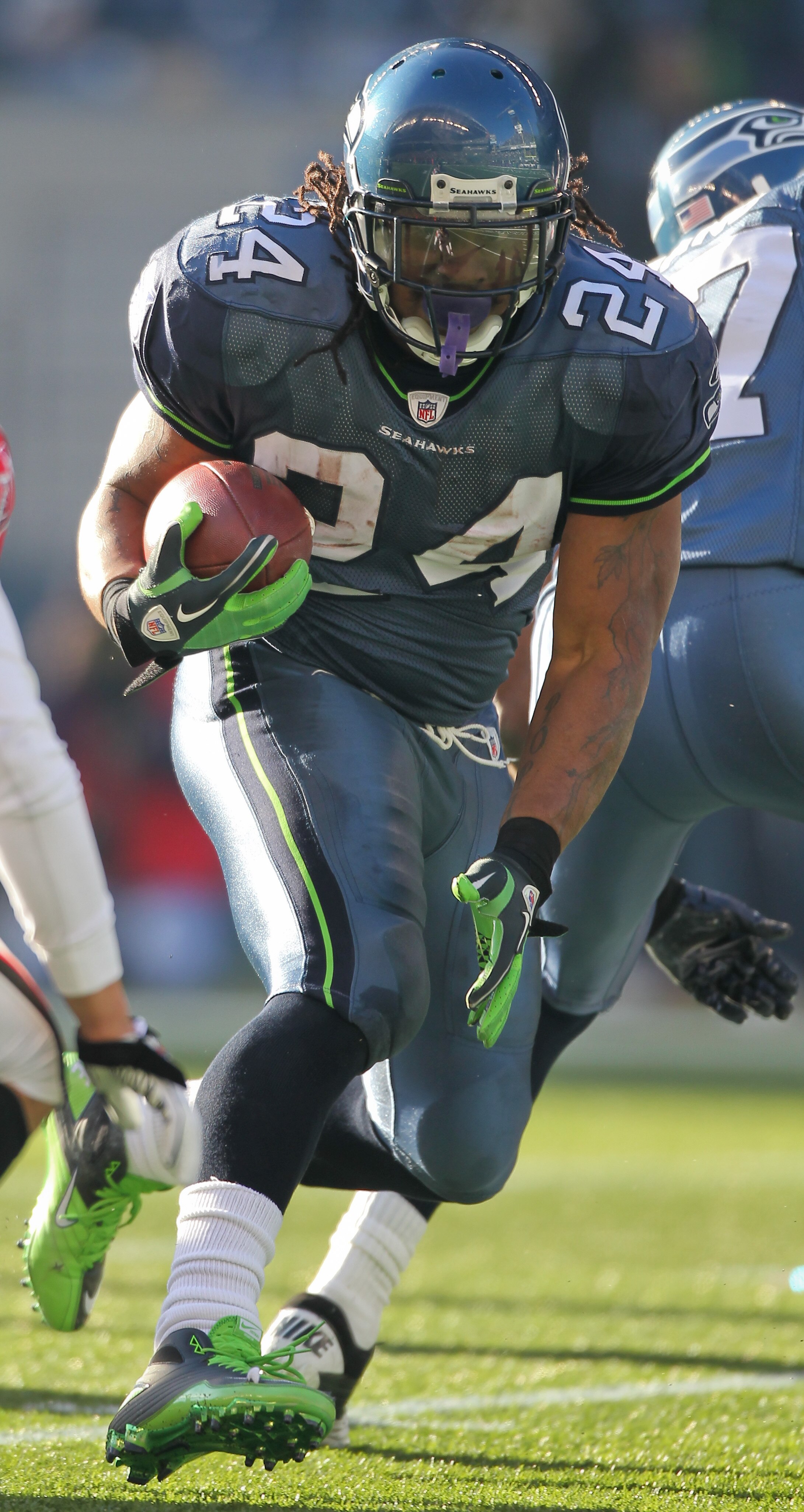 SEATTLE, WA - DECEMBER 19:  Running back Marshawn Lynch #24 of the Seattle Seahawks rushes against the Atlanta Falcons at Qwest Field on December 19, 2010 in Seattle, Washington. (Photo by Otto Greule Jr/Getty Images)