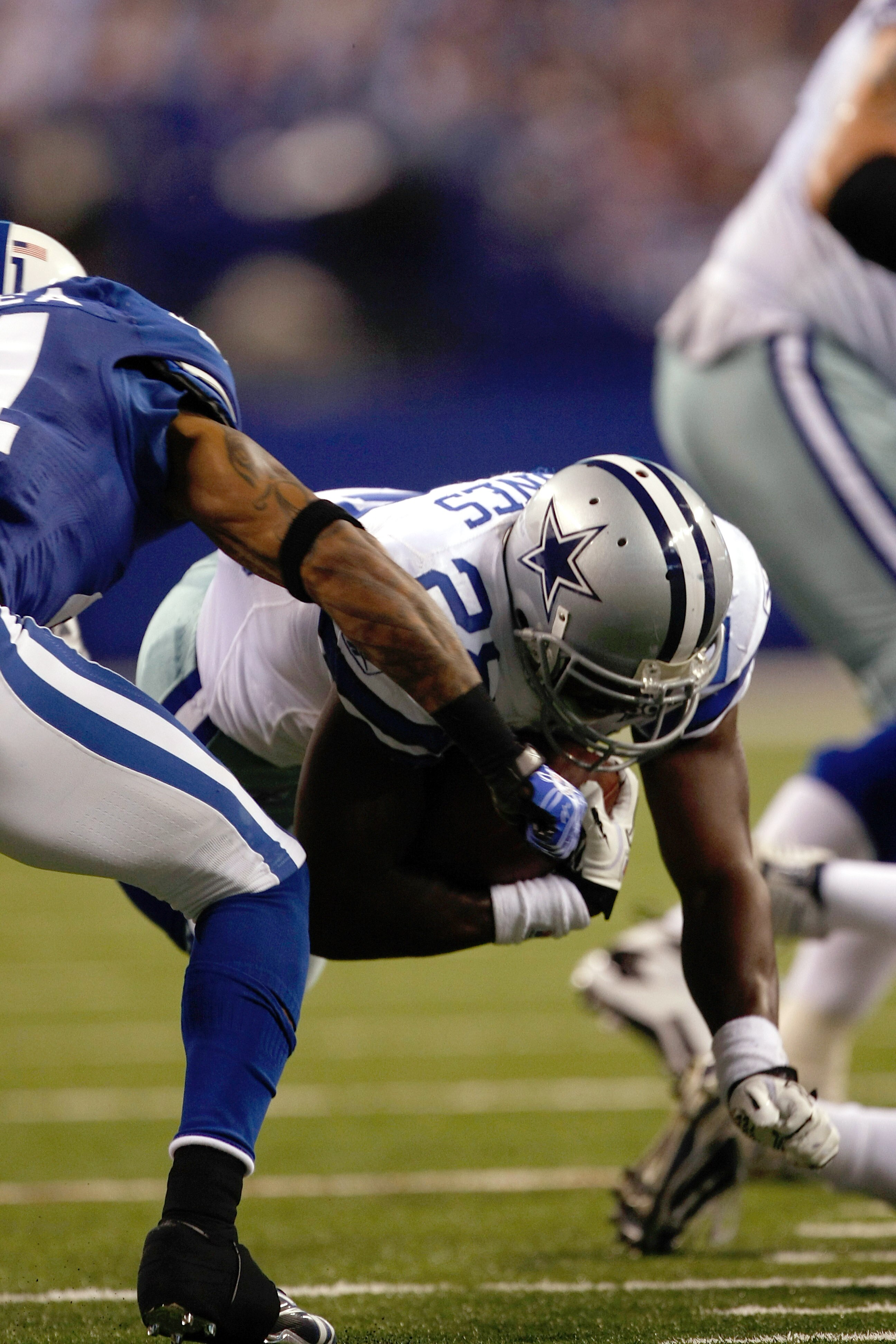 INDIANAPOLIS, IN - DECEMBER 05: Felix Jones #28 of the Dallas Cowboys dives against the Indianapolis Colts at Lucas Oil Stadium on December 5, 2010 in Indianapolis, Indiana.  (Photo by Scott Boehm/Getty Images)