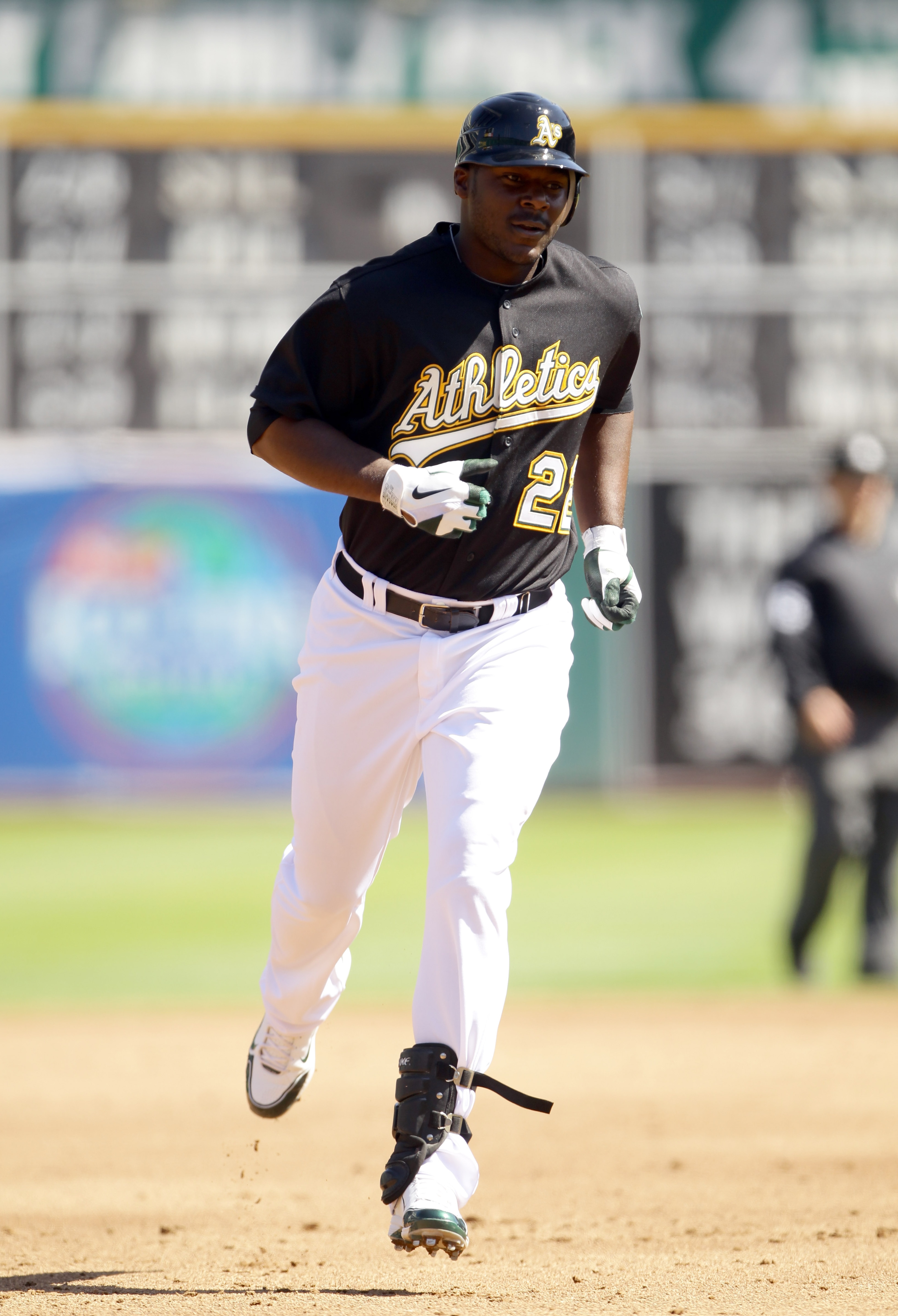 OAKLAND, CA - SEPTEMBER 22:  Chris Carter #22 of the Oakland Athletics rounds the bases after hitting his first major league home run against the Chicago White Sox at the Oakland-Alameda County Coliseum on September 22, 2010 in Oakland, California.  (Phot