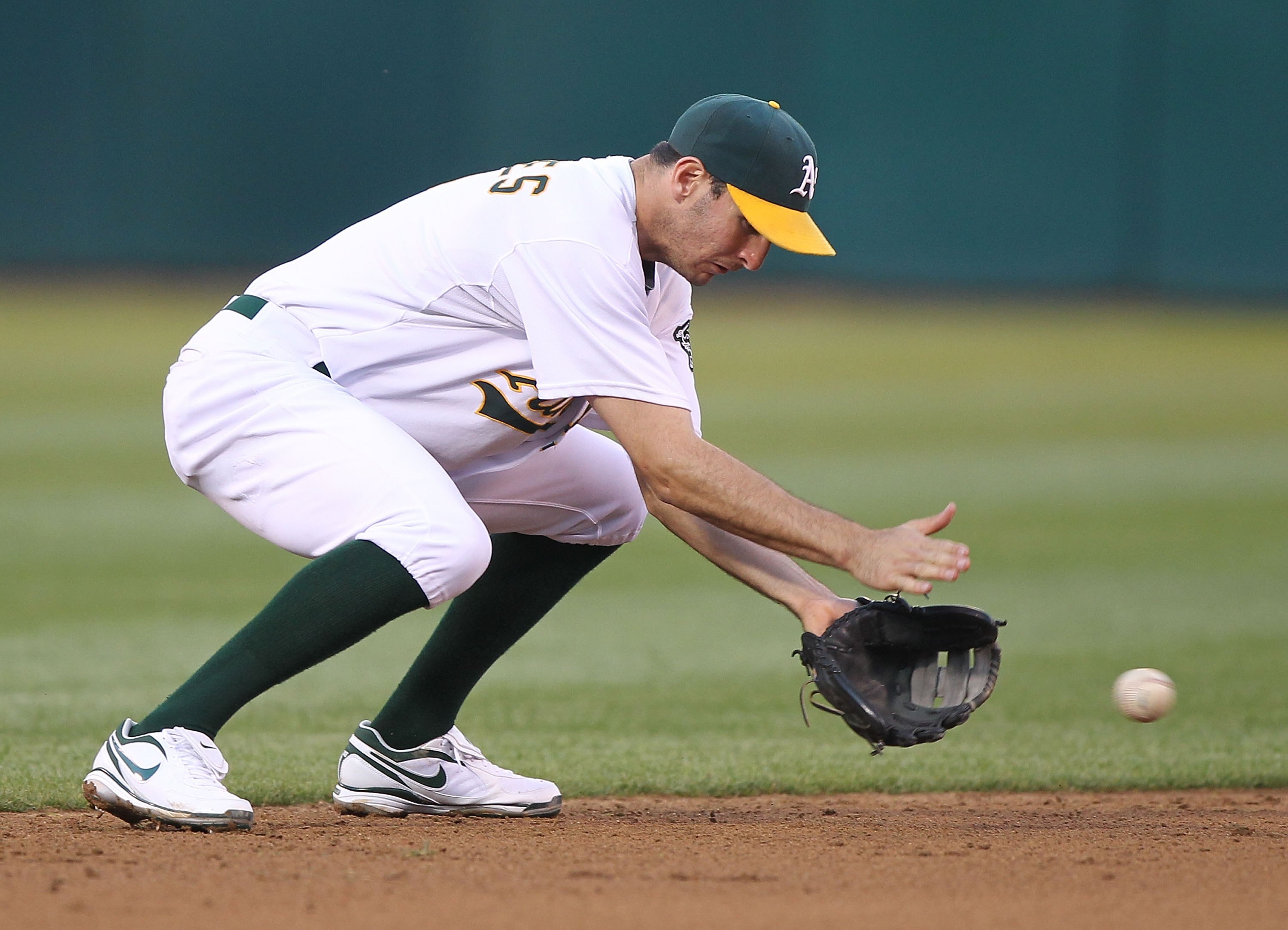 OAKLAND, CA - JUNE 04:  Adam Rosales #7 of the Oakland Athletics throws to first against the Minnesota Twins during an MLB game at the Oakland-Alameda County Coliseum on June 4, 2010 in Oakland, California.  (Photo by Jed Jacobsohn/Getty Images)