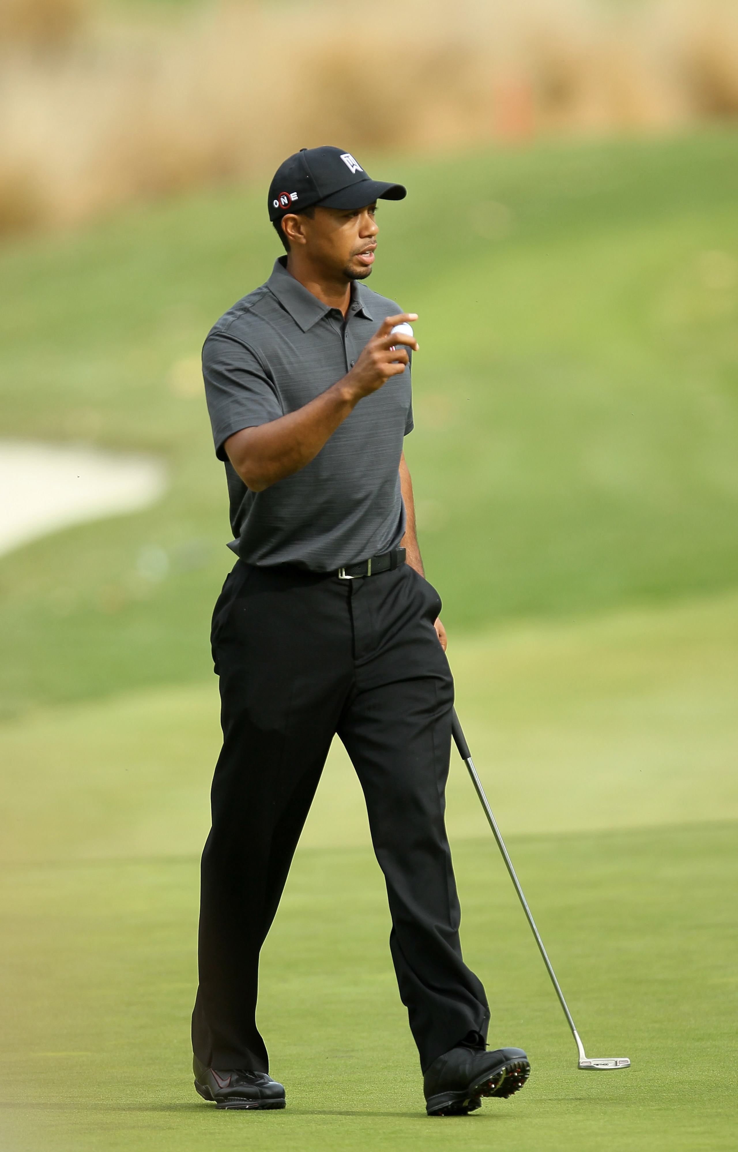 THOUSAND OAKS, CA - DECEMBER 03:  Tiger Woods holds up his ball after making his birdie putt on the fourth hole during round two of the Chevron World Challenge at Sherwood Country Club on December 3, 2010 in Thousand Oaks, California.  (Photo by Stephen D