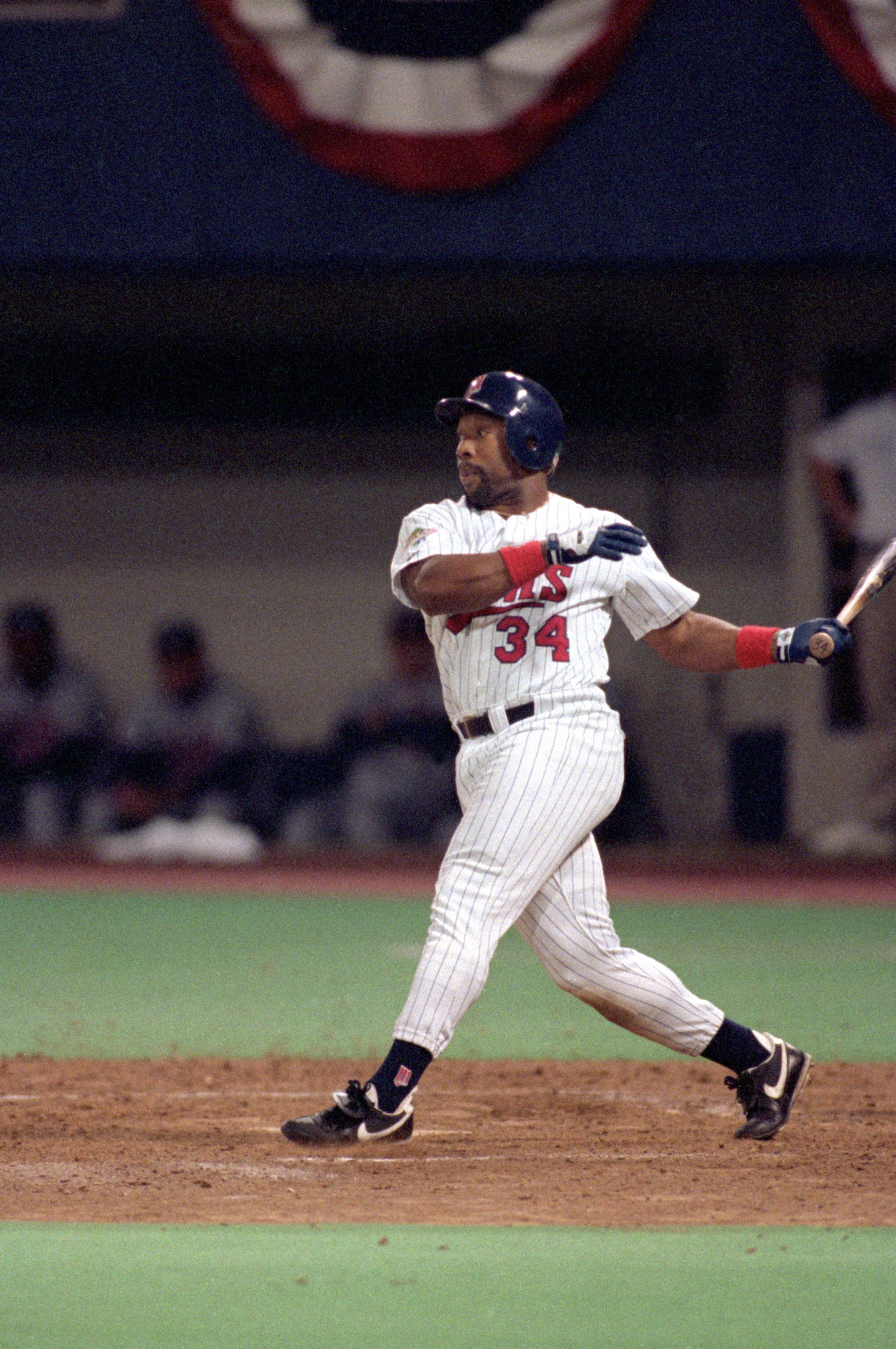 MINNEAPOLIS - OCTOBER 27:  Kirby Puckett #34 of the Minnesota Twins swings at a pitch during Game seven of the 1991 World Series against the Atlanta Braves at the Metrodome on October 27, 1991 in Minneapolis, Minnesota. The Twins defeated the Braves 1-0 i