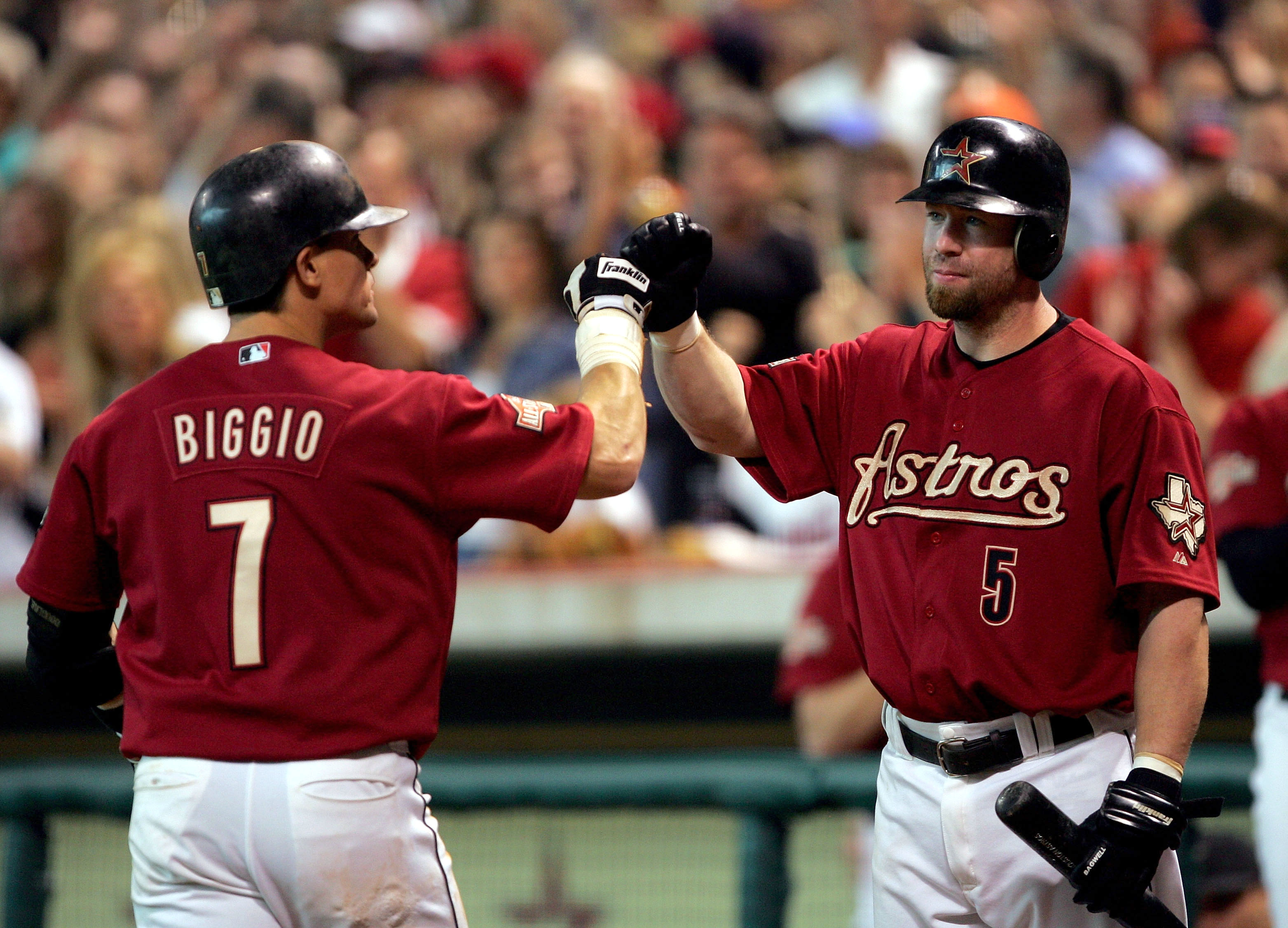 HOUSTON - OCTOBER 10:  Craig Biggio #7 of the Houston Astros is congratulated by Jeff Bagwell #5 after hitting a home run against the Atlanta Braves during the second inning of game four of the National League Divisional Series on October 10, 2004 at Minu