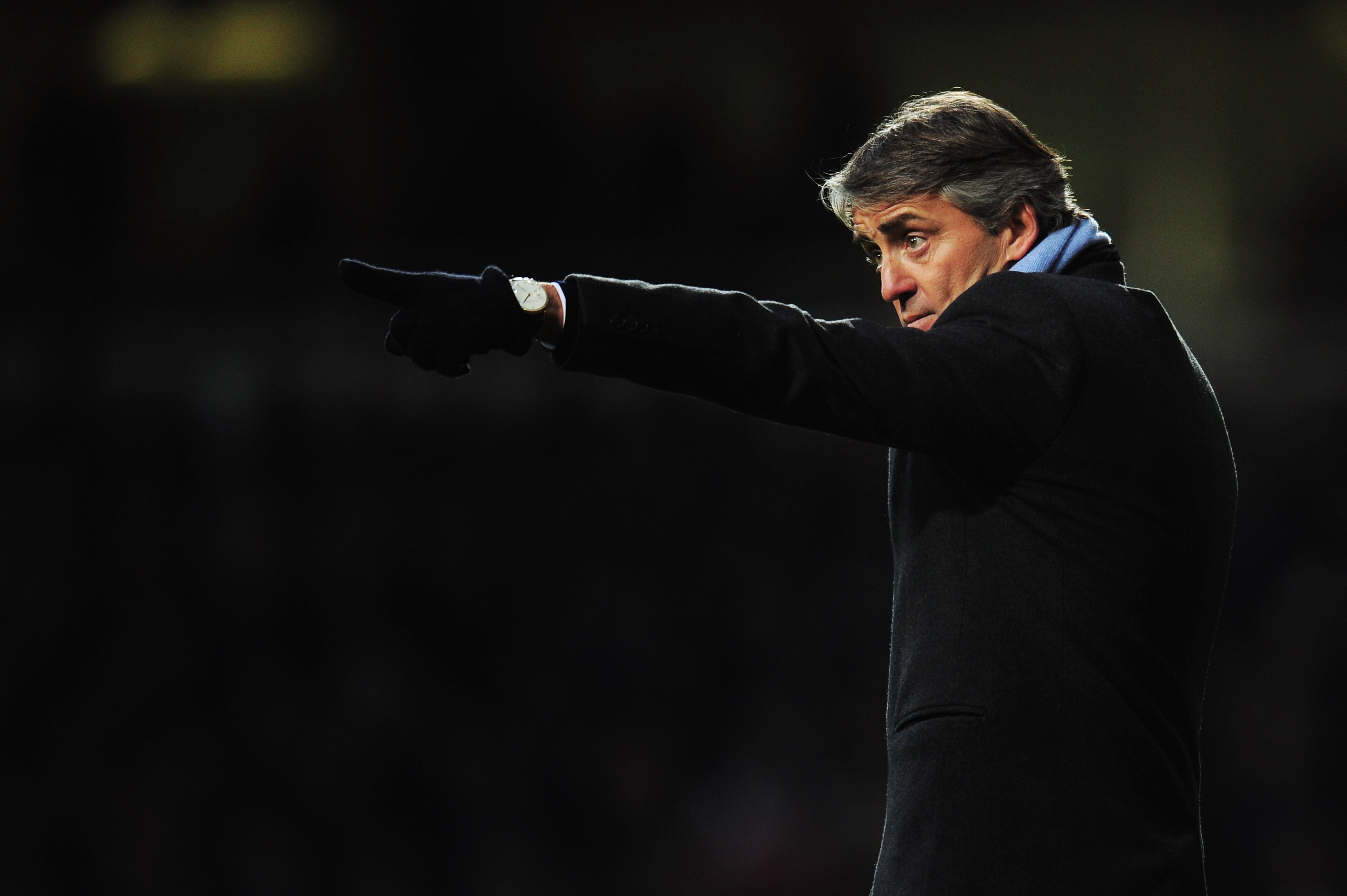 LONDON, UNITED KINGDOM - DECEMBER 11:  Roberto Mancini the Manchester City manager gives instructions to his players from the touchline during the Barclays Premier League match between West Ham United and Manchester City at Upton Park on December 11, 2010