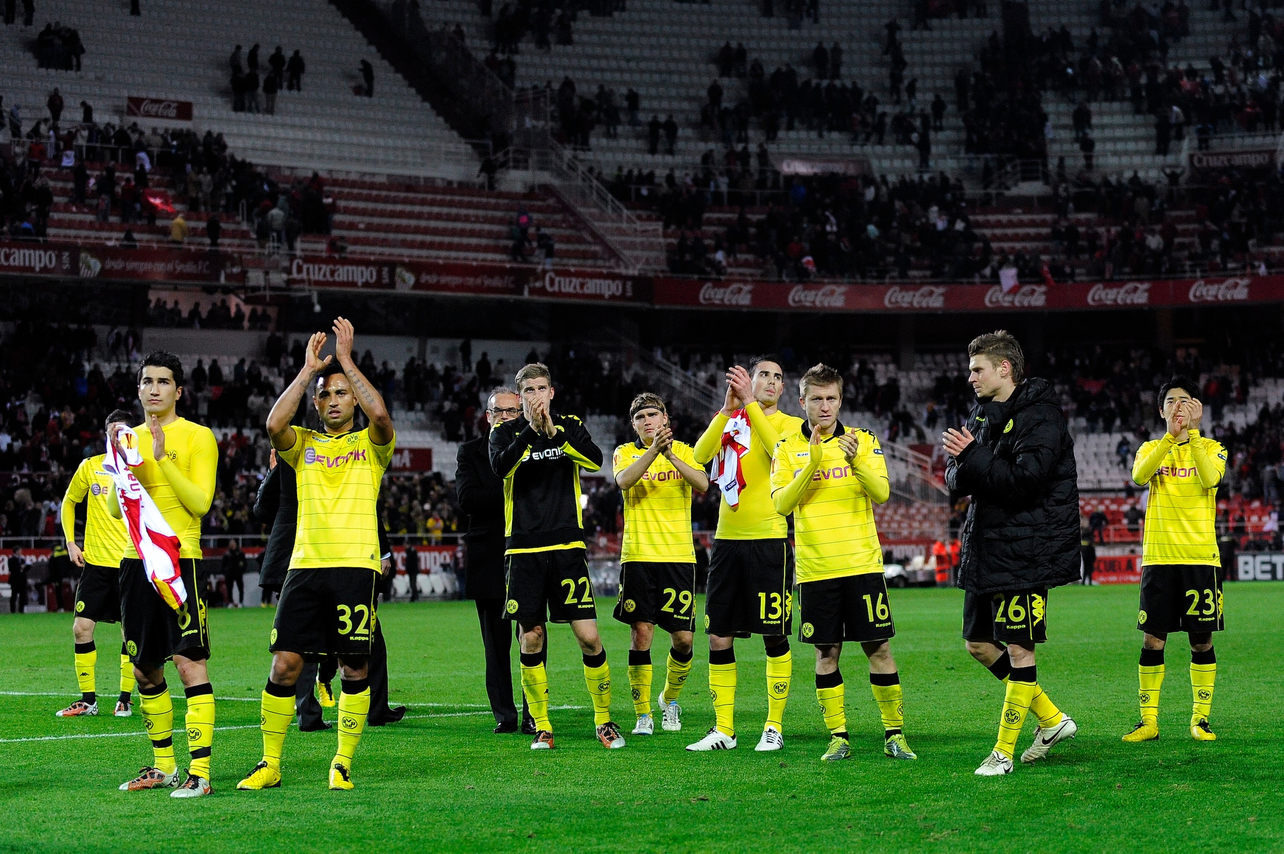 SEVILLE, SPAIN - DECEMBER 15: Borussi Dortmund players acknowledge  fans at the end of the UEFA Europa League group J match between Sevilla and Borussia Dortmund at Estadio Ramon Sanchez Pizjuan on December 15, 2010 in Seville, Spain. The match ended 2-2.