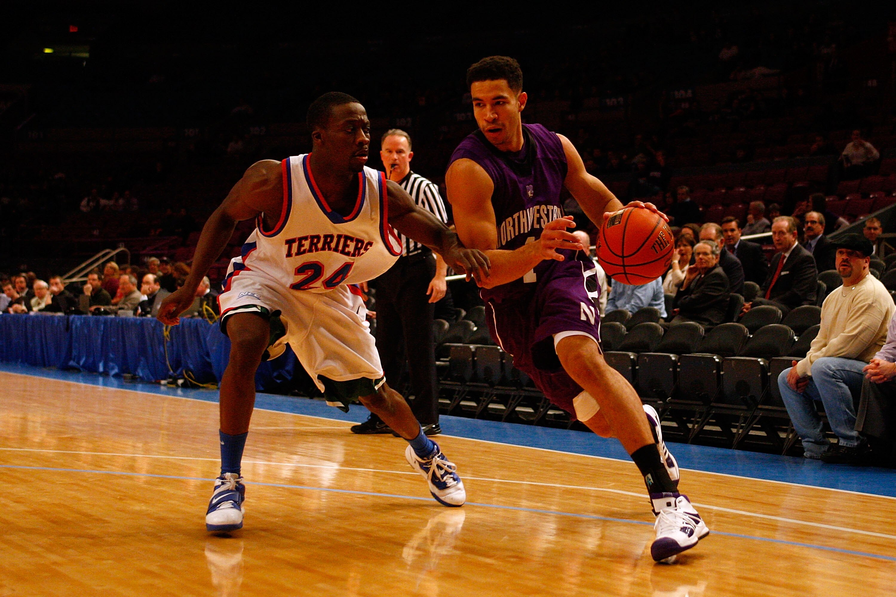 NEW YORK, NY - DECEMBER 20:  Drew Crawford #1 of the Northwestern Wildcats drives against Akeem Bennett #24 of the St. Francis Terriers during the Madison Square Garden Holiday Festival at Madison Square Garden on December 20, 2010 in New York City.  (Pho