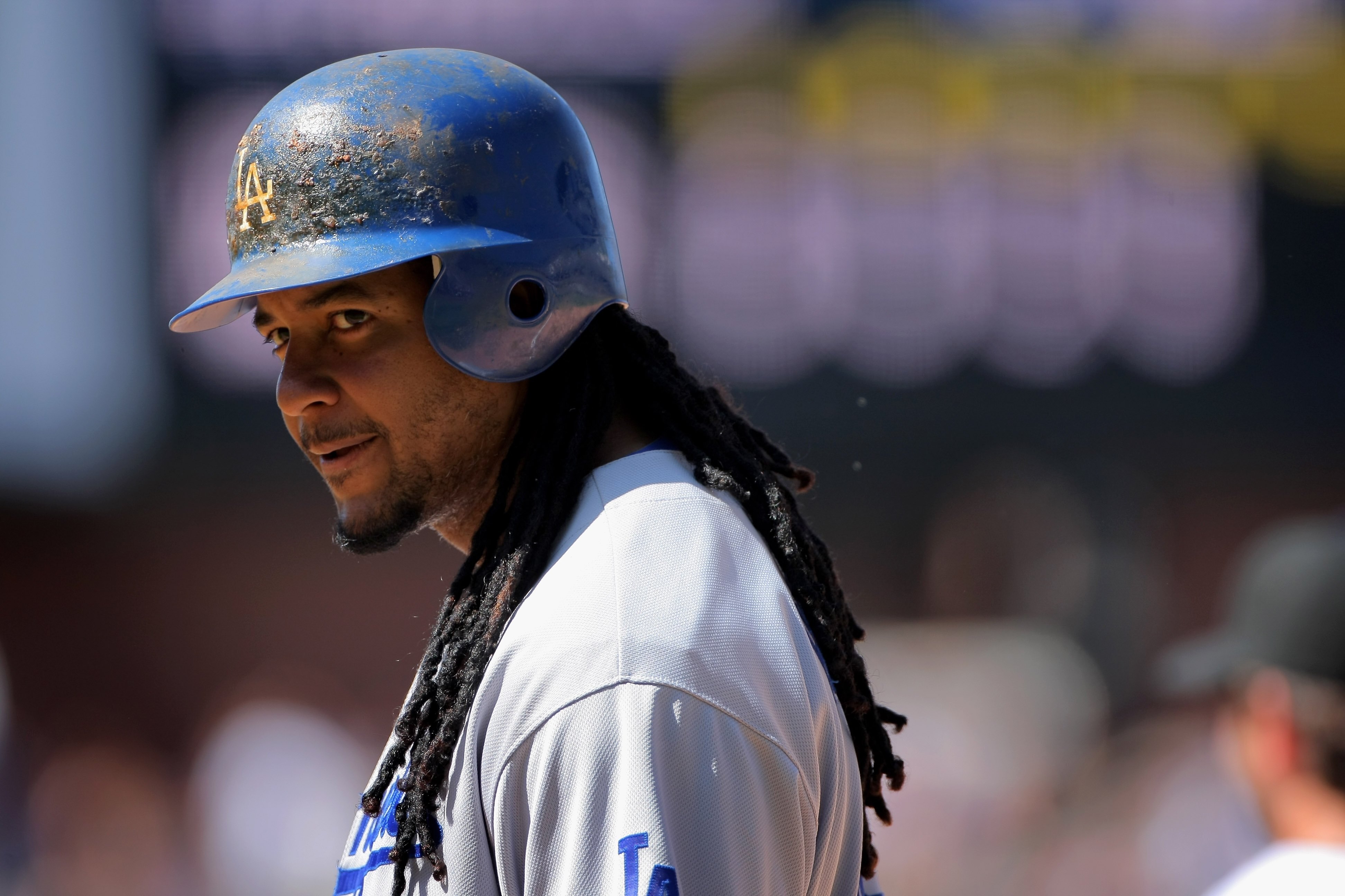 DENVER - AUGUST 27:  Manny Ramirez #99 of the Los Angeles Dodgers looks on from first base against the Colorado Rockies at Coors Field on August 27, 2009 in Denver, Colorado. The Dodgers defeated the Rockies 3-2.  (Photo by Doug Pensinger/Getty Images)