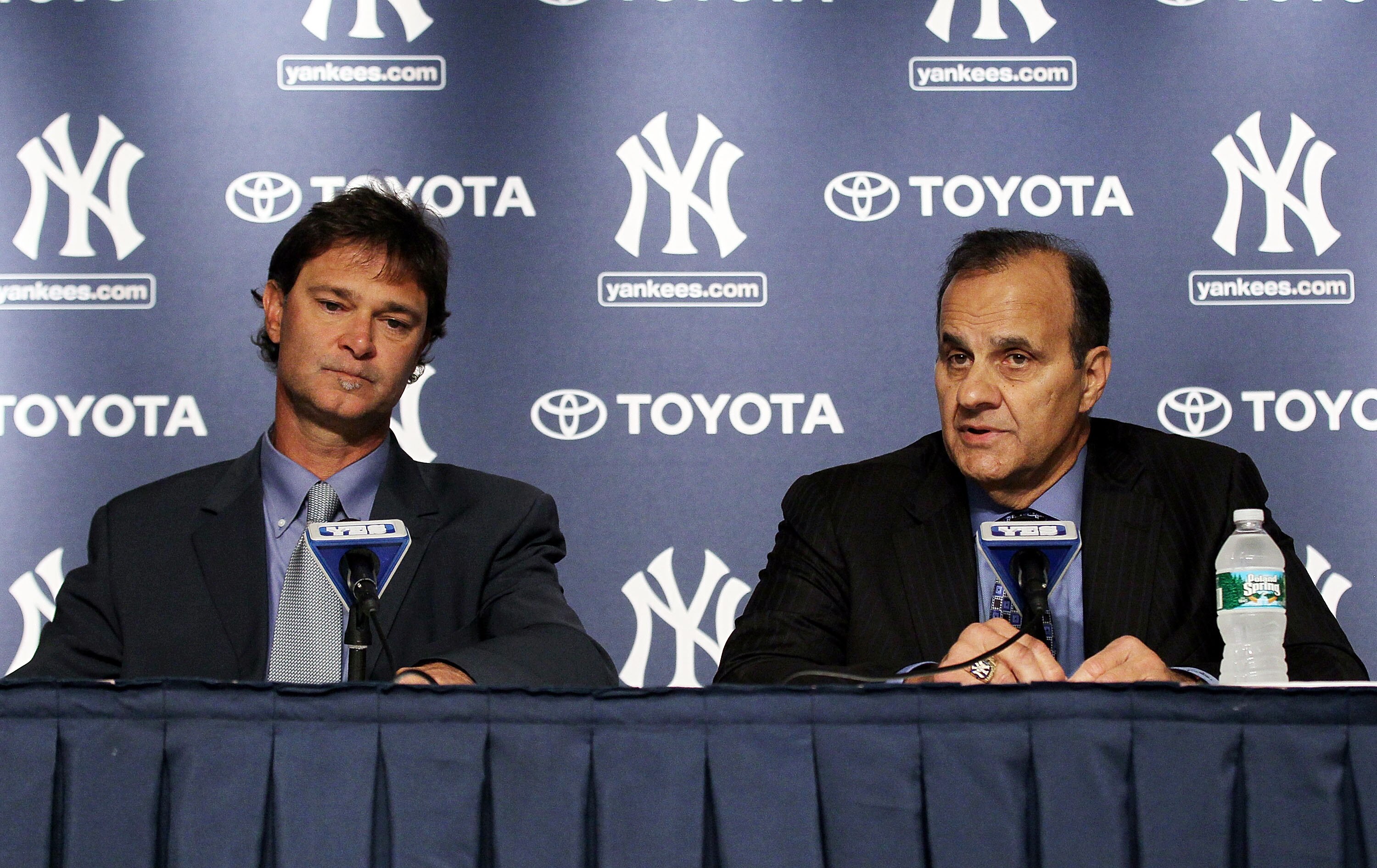NEW YORK - SEPTEMBER 20:  Former New York Yankees manager Joe Torre (R) and former player Don Mattingly speak to the media prior to the game against the Tampa Bay Rays on September 20, 2010 at Yankee Stadium in the Bronx borough of New York City.  (Photo