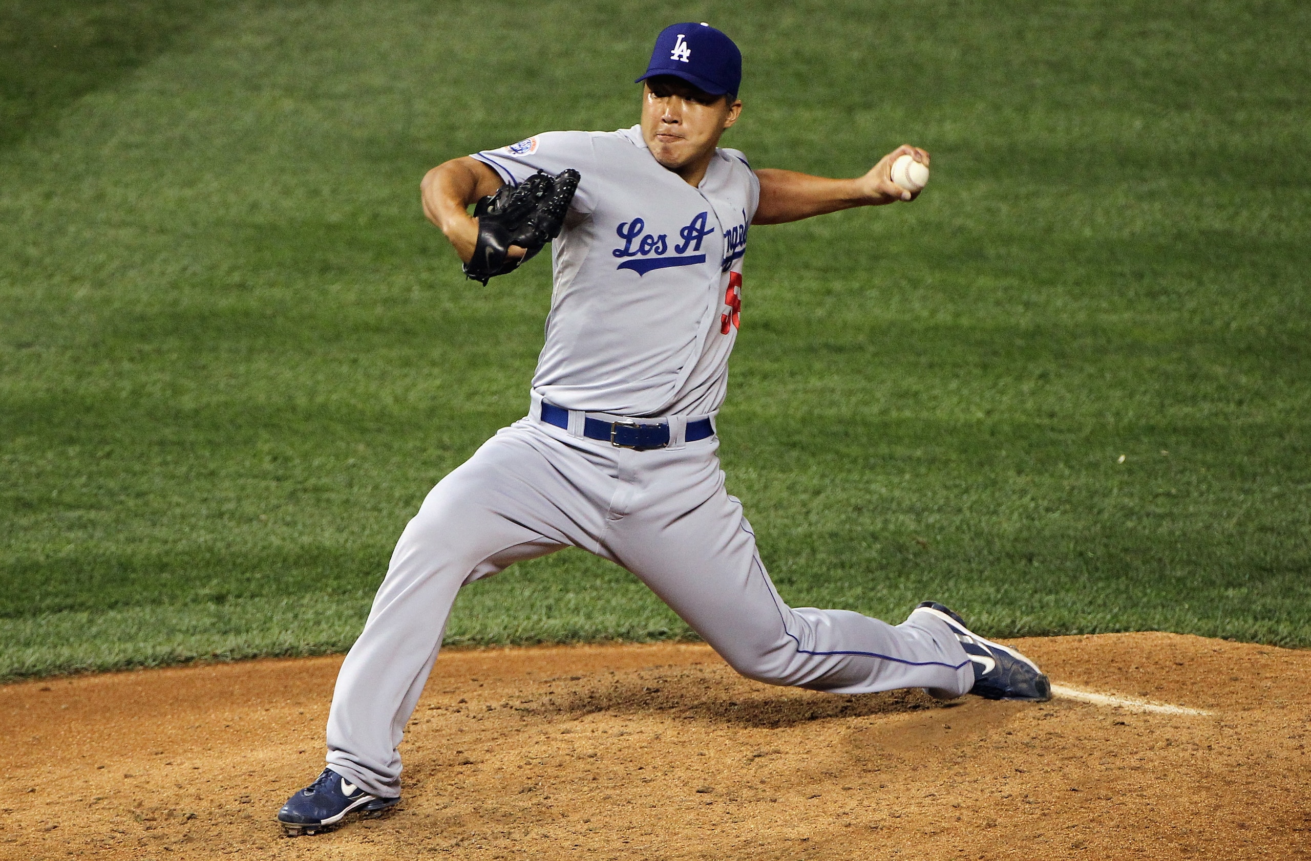 DENVER - SEPTEMBER 27: Relief pitcher Hong-Chih Kuo #56 of the Los Angeles Dodgers delivers against the Colorado Rockies at Coors Field on September 25, 2010 in Denver, Colorado. Kuo earned the save as the Dodgers defeated the Rockies 3-1. (Photo by Dou DENVER - SEPTEMBER 27: Relief pitcher Hong-Chih Kuo #56 of the Los Angeles Dodgers delivers against the Colorado Rockies at Coors Field on September 25, 2010 in Denver, Colorado. Kuo earned the save as the Dodgers defeated the Rockies 3-1. (Photo by Dou