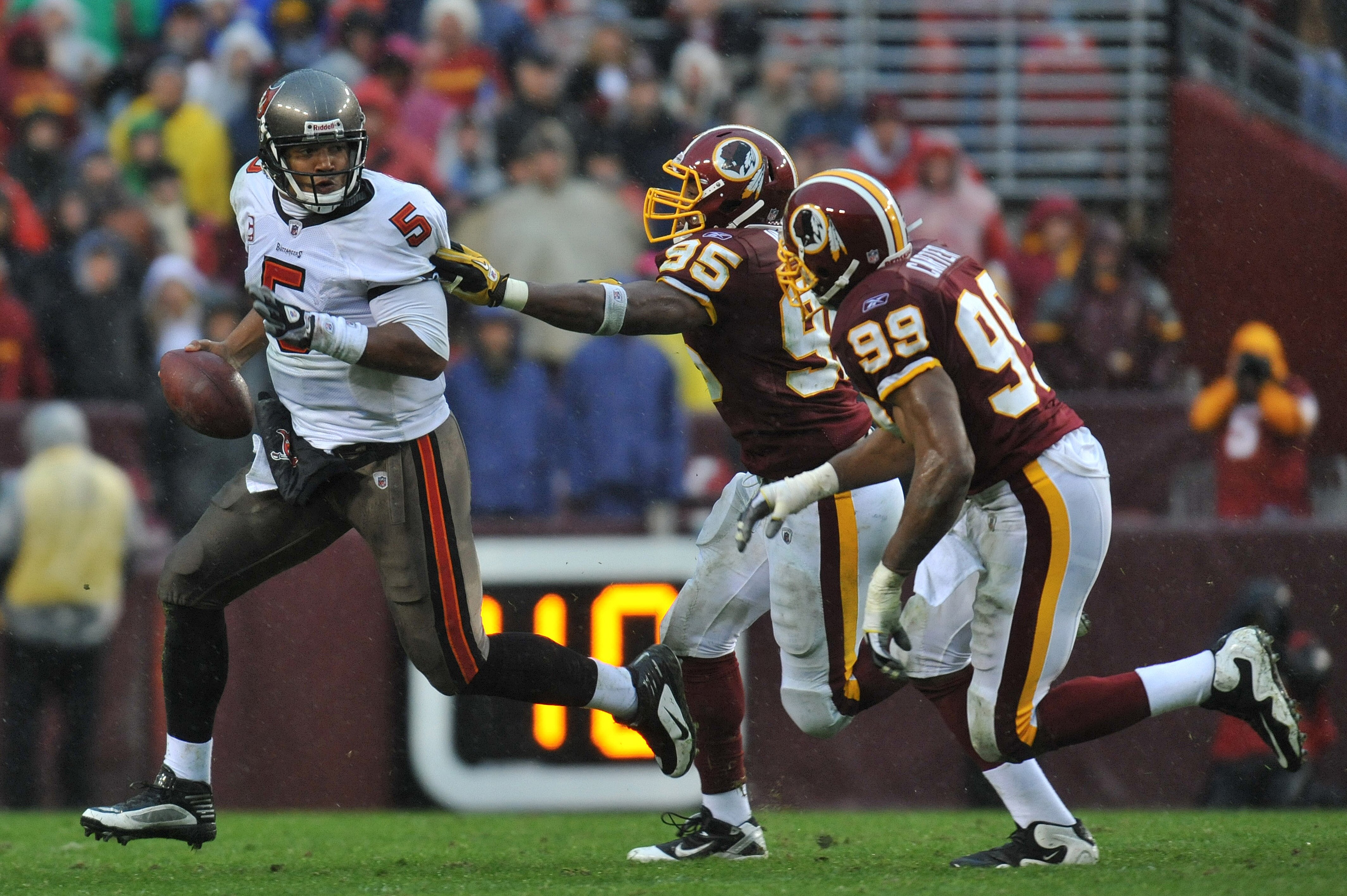 LANDOVER, MD - DECEMBER 12:  Josh Freeman #5 of the Tampa Bay Buccaneers scrambles during the game against the Washington Redskins  at FedExField on December 12, 2010 in Landover, Maryland. The Buccaneers defeated the Redskins 17-16. (Photo by Larry Frenc