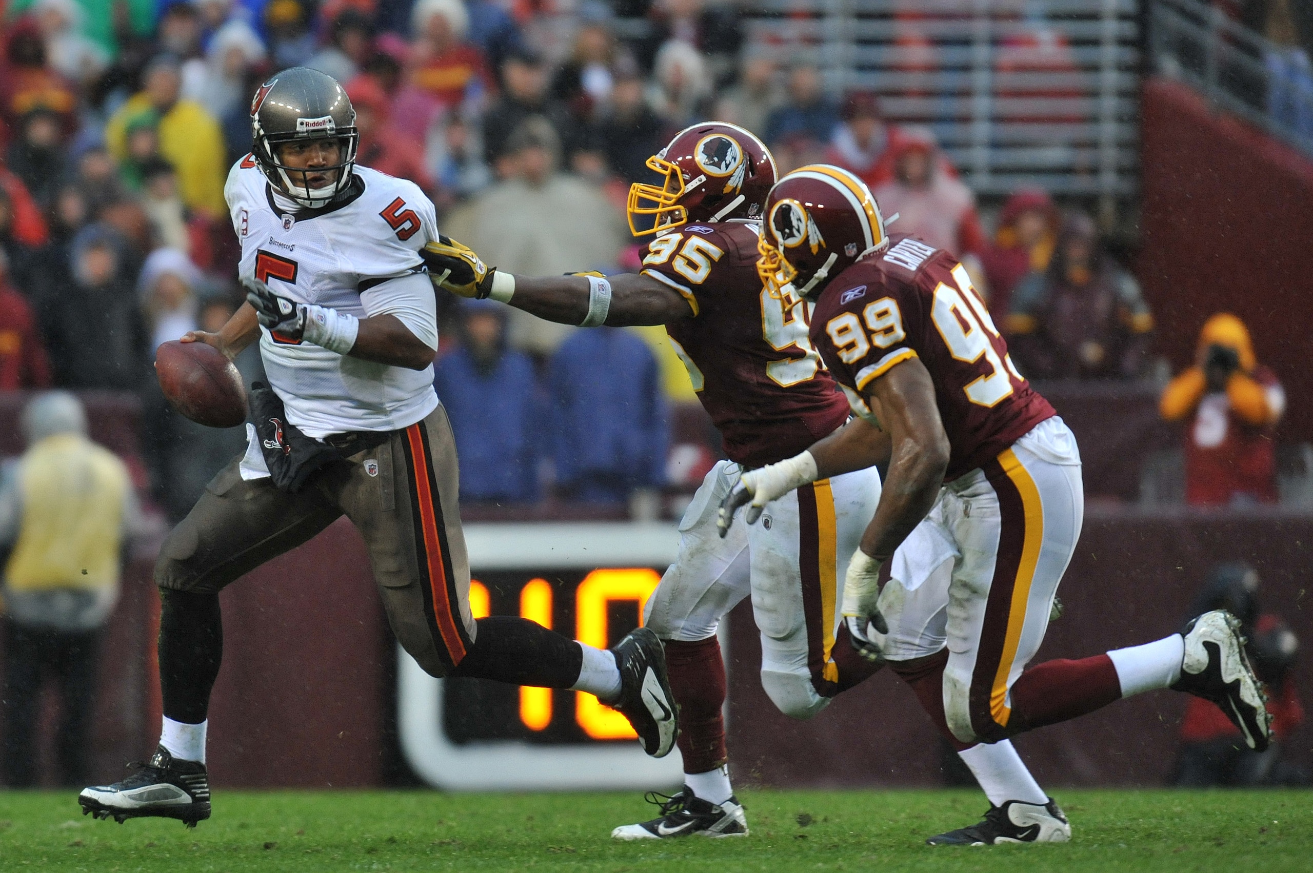 LANDOVER, MD - DECEMBER 12:  Josh Freeman #5 of the Tampa Bay Buccaneers scrambles during the game against the Washington Redskins  at FedExField on December 12, 2010 in Landover, Maryland. The Buccaneers defeated the Redskins 17-16. (Photo by Larry Frenc