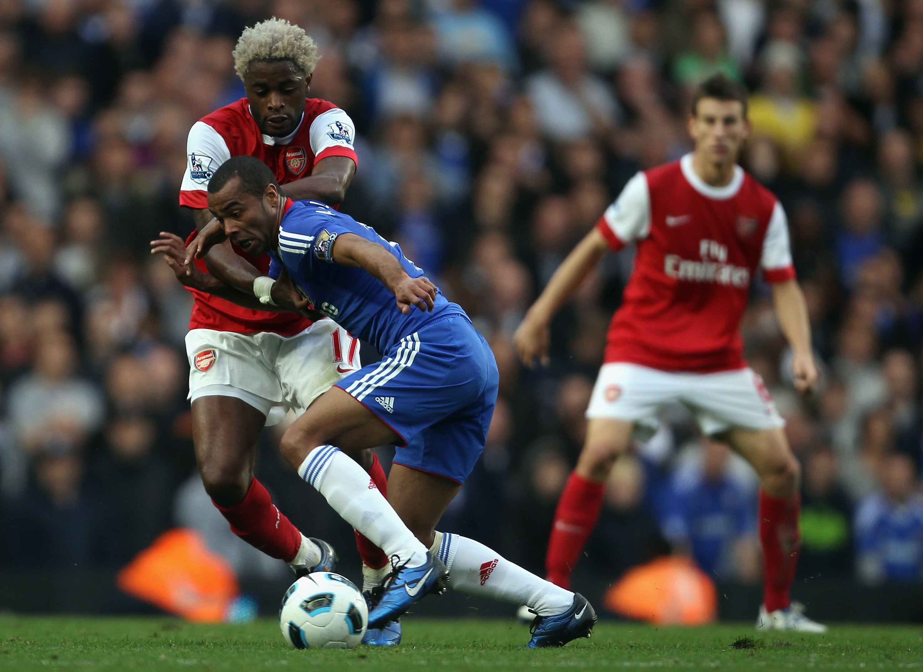 LONDON, ENGLAND - OCTOBER 03:  Ashley Cole of Chelsea battles with Alex Song of Arsenal during the Barclays Premier League match between Chelsea and Arsenal at Stamford Bridge on October 3, 2010 in London, England.  (Photo by Bryn Lennon/Getty Images)