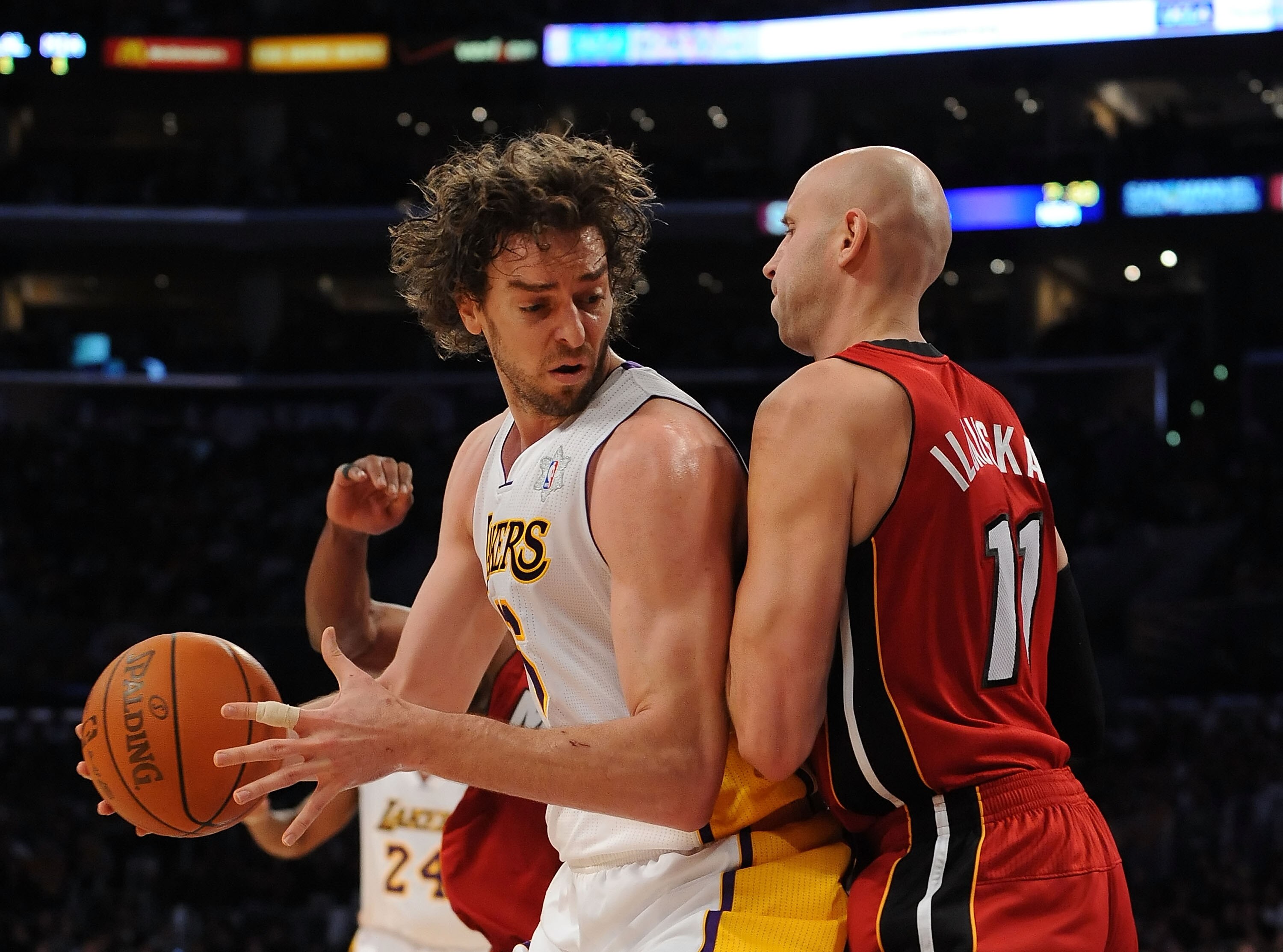 LOS ANGELES, CA - DECEMBER 25:  Pau Gasol #16 of the Los Angeles Lakers drives against Zydrunas Ilgauskas #11 of the Miami Heat at Staples Center on December 25, 2010 in Los Angeles, California. NOTE TO USER: User expressly acknowledges and agrees that, b
