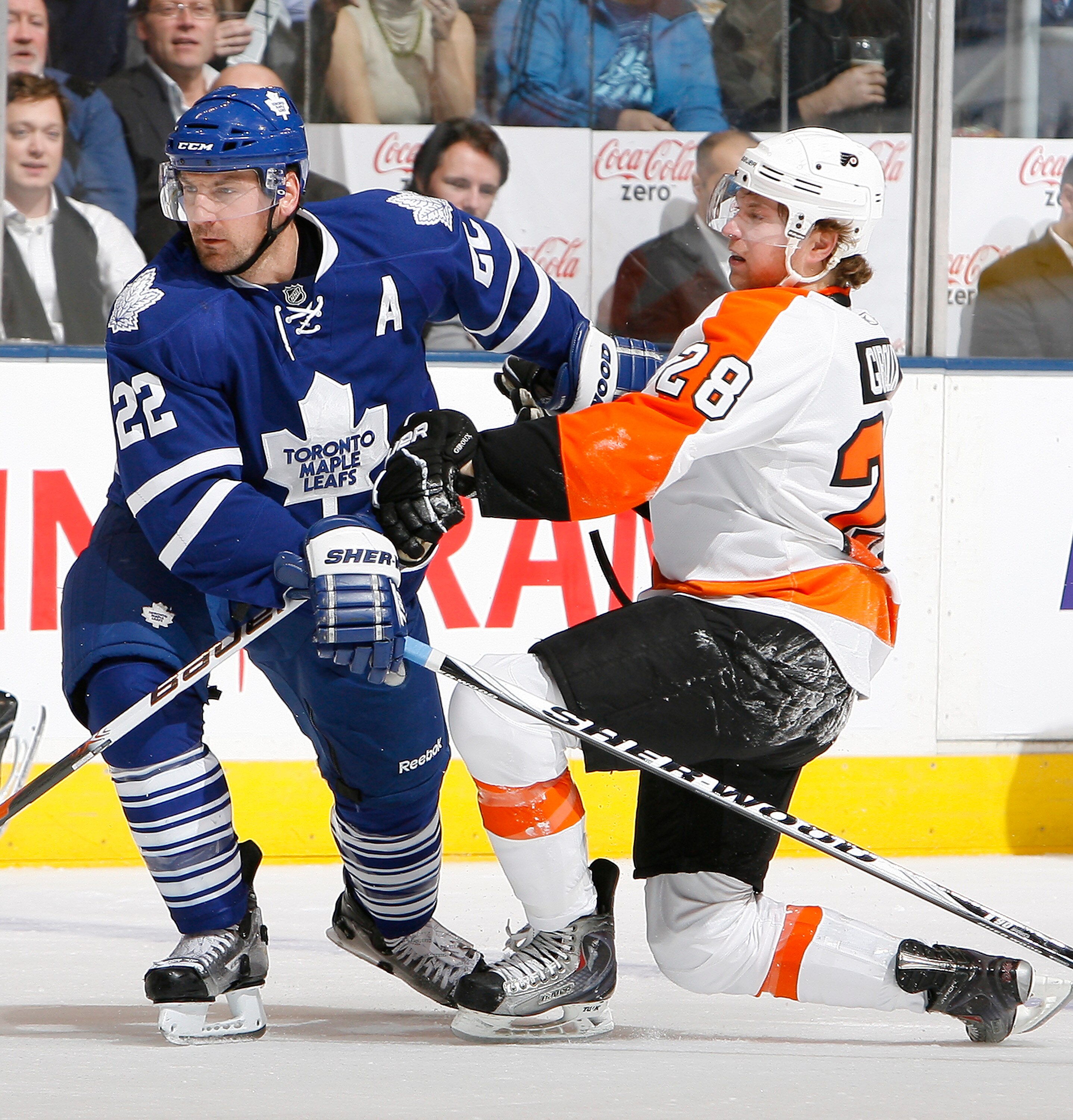 TORONTO, CANADA - DECEMBER 9: Francois Beauchemin #22 of the Toronto Maple Leafs runs into Claude Giroux #28 of the Philadelphia Flyers during game action at the Air Canada Centre December 9, 2010 in Toronto, Ontario, Canada. (Photo by Abelimages/Getty Im
