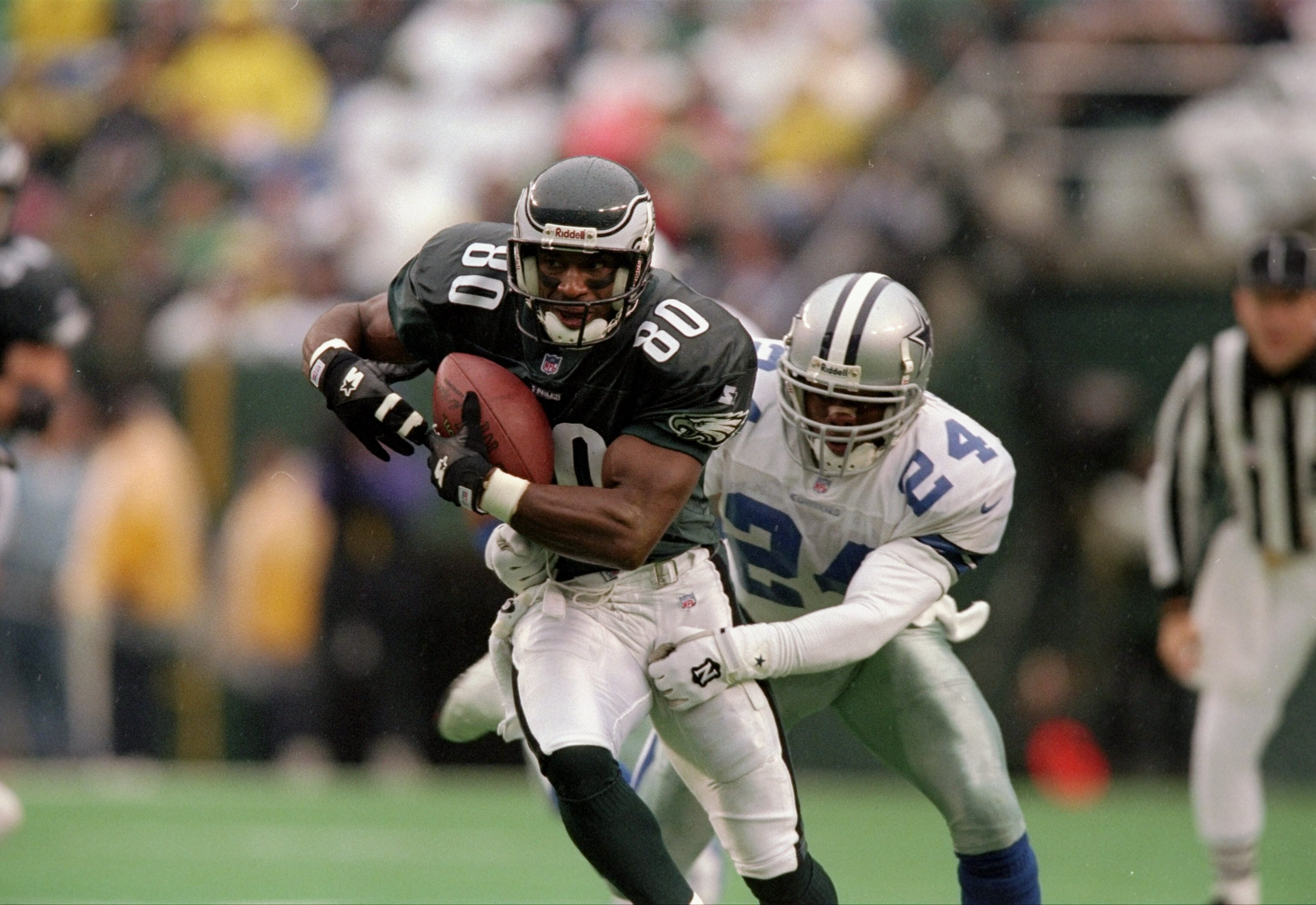 26 Oct 1997:  Defensive back Omar Stoutmire of the Dallas Cowboys (right) attempts to tackle wide receiver Irving Fryar of the Philadelphia Eagles during a game at Veterans Stadium in Philadelphia, Pennsylvania.  The Eagles won the game, 13-12. Mandatory