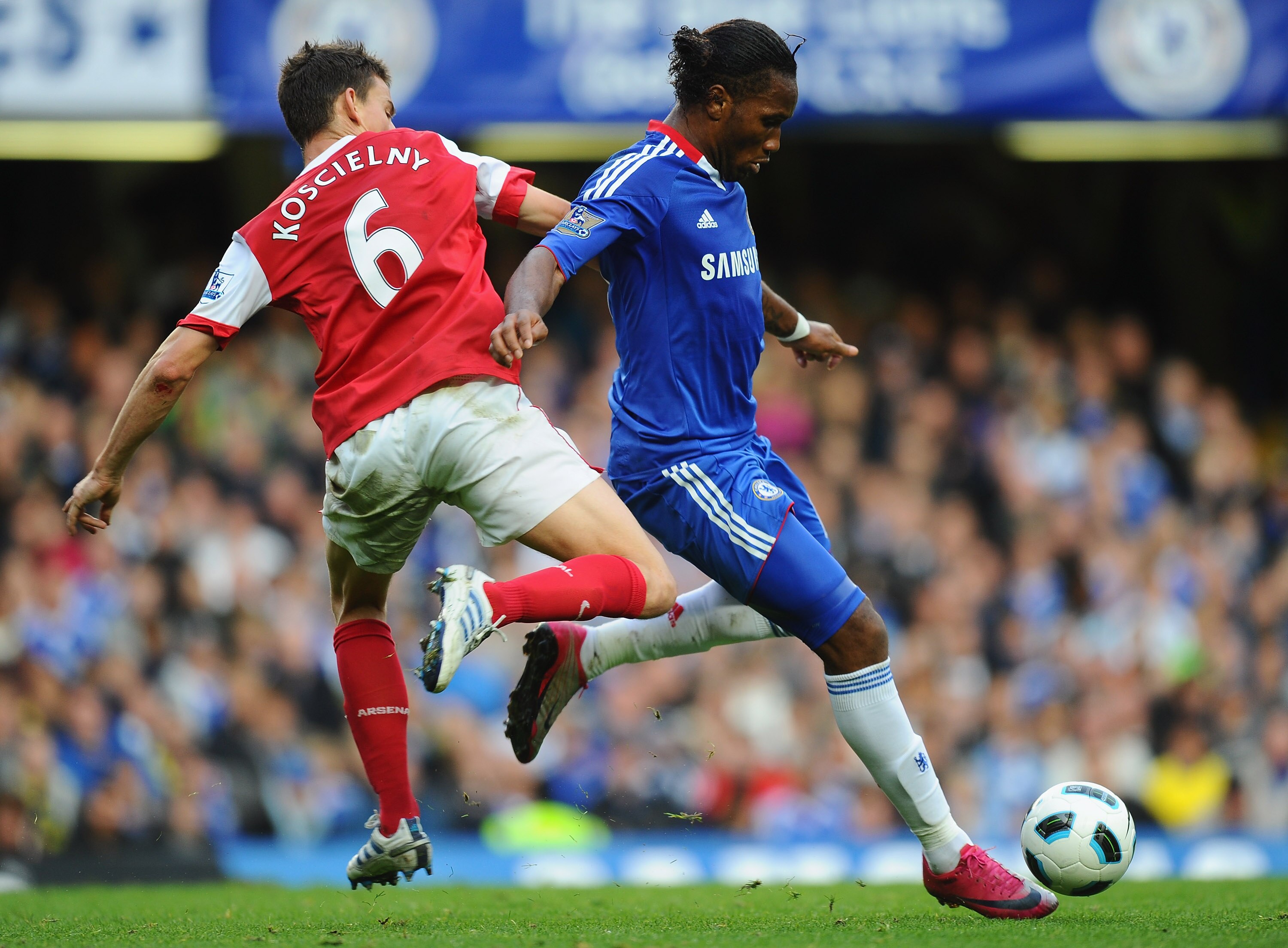 LONDON, ENGLAND - OCTOBER 03:  Didier Drogba of Chelsea is challenged by Laurent Koscielny of Arsenal during the Barclays Premier League match between Chelsea and Arsenal at Stamford Bridge on October 3, 2010 in London, England.  (Photo by Mike Hewitt/Get