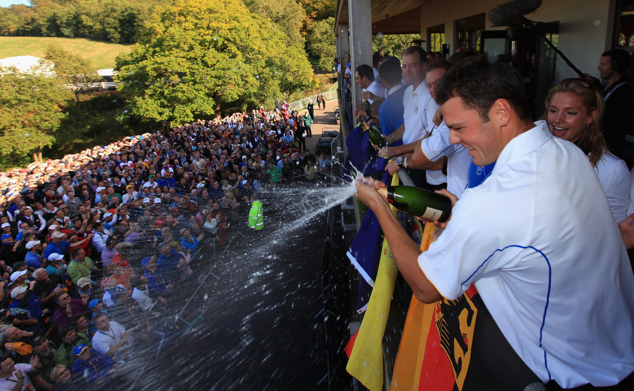 NEWPORT, WALES - OCTOBER 04:  Martin Kaymer of Europe sprays champagne on the balcony of the clubhouse following Europe's victory in the 2010 Ryder Cup at the Celtic Manor Resort on October 4, 2010 in Newport, Wales.  (Photo by David Cannon/Getty Images)