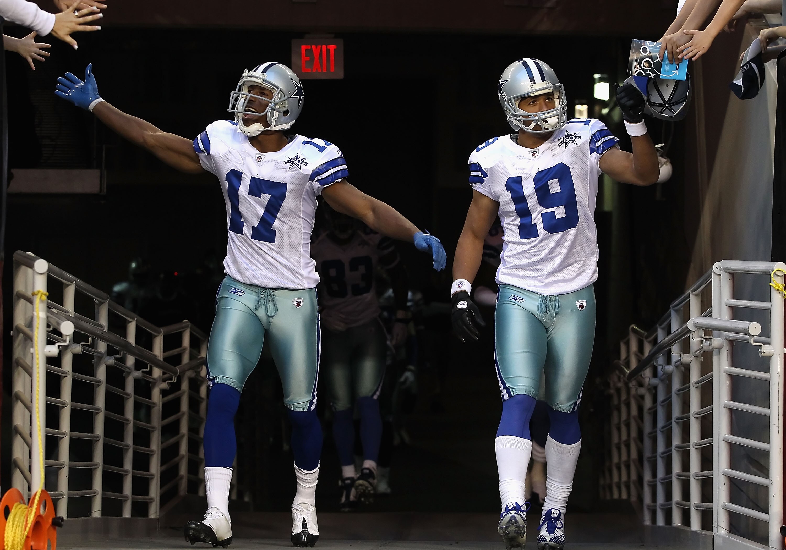 GLENDALE, AZ - DECEMBER 25:  Sam Hurd #17 and Miles Austin #19 of the Dallas Cowboys walk out onto the field before the NFL game against the Arizona Cardinals at the University of Phoenix Stadium on December 25, 2010 in Glendale, Arizona.  The Cardinals d