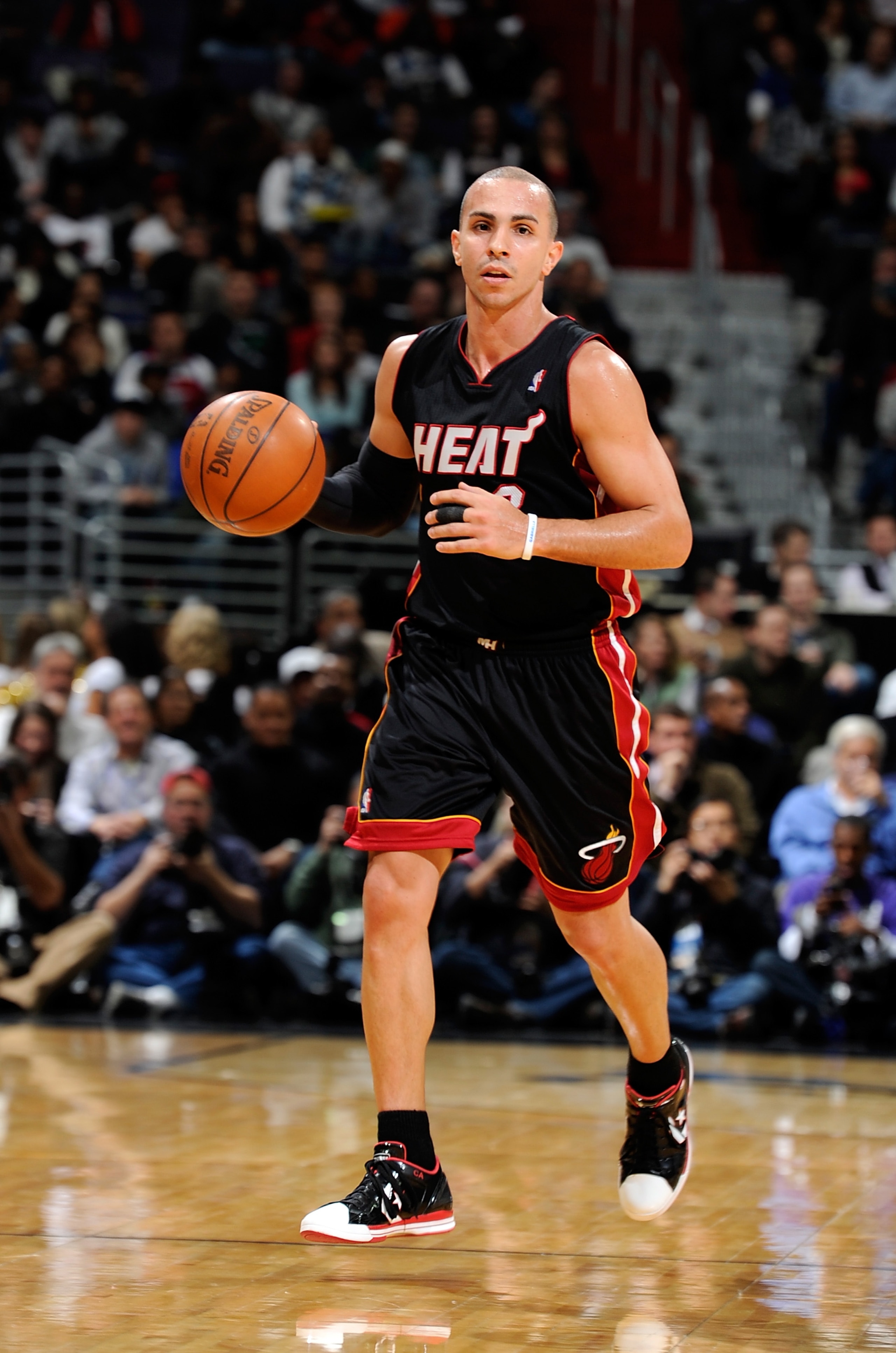WASHINGTON, DC - DECEMBER 18:  Carlos Arroyo #8 of the Miami Heat brings the ball up the court against the Washington Wizards at the Verizon Center on December 18, 2010 in Washington, DC. NOTE TO USER: User expressly acknowledges and agrees that, by downl
